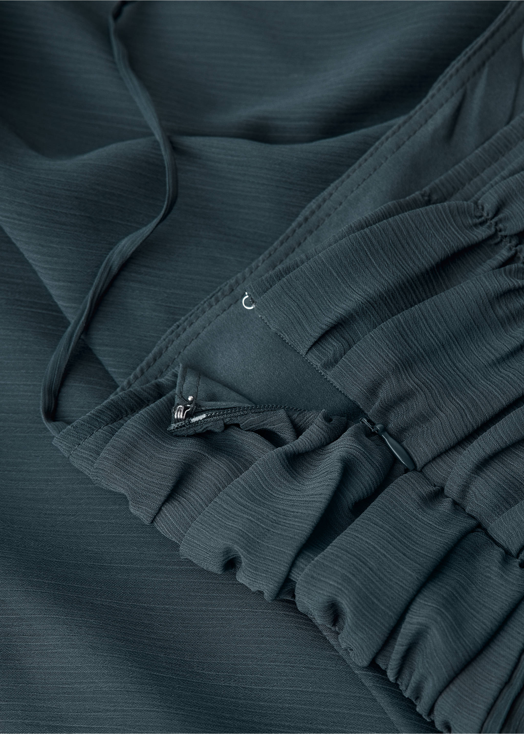Close-up of the textured fabric and side zip fastening on a dark green dress., Charcoal. Ref: 37041552-00.