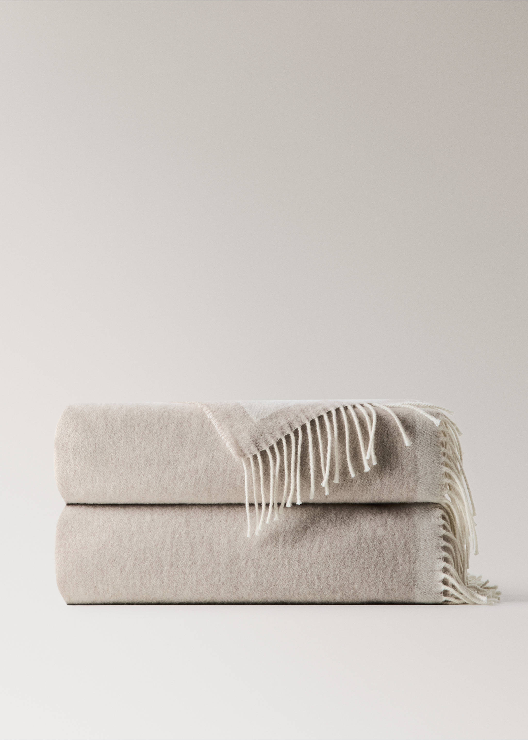 Stack of two beige blankets with white fringed edges., Beige. Ref: 37042554-00.