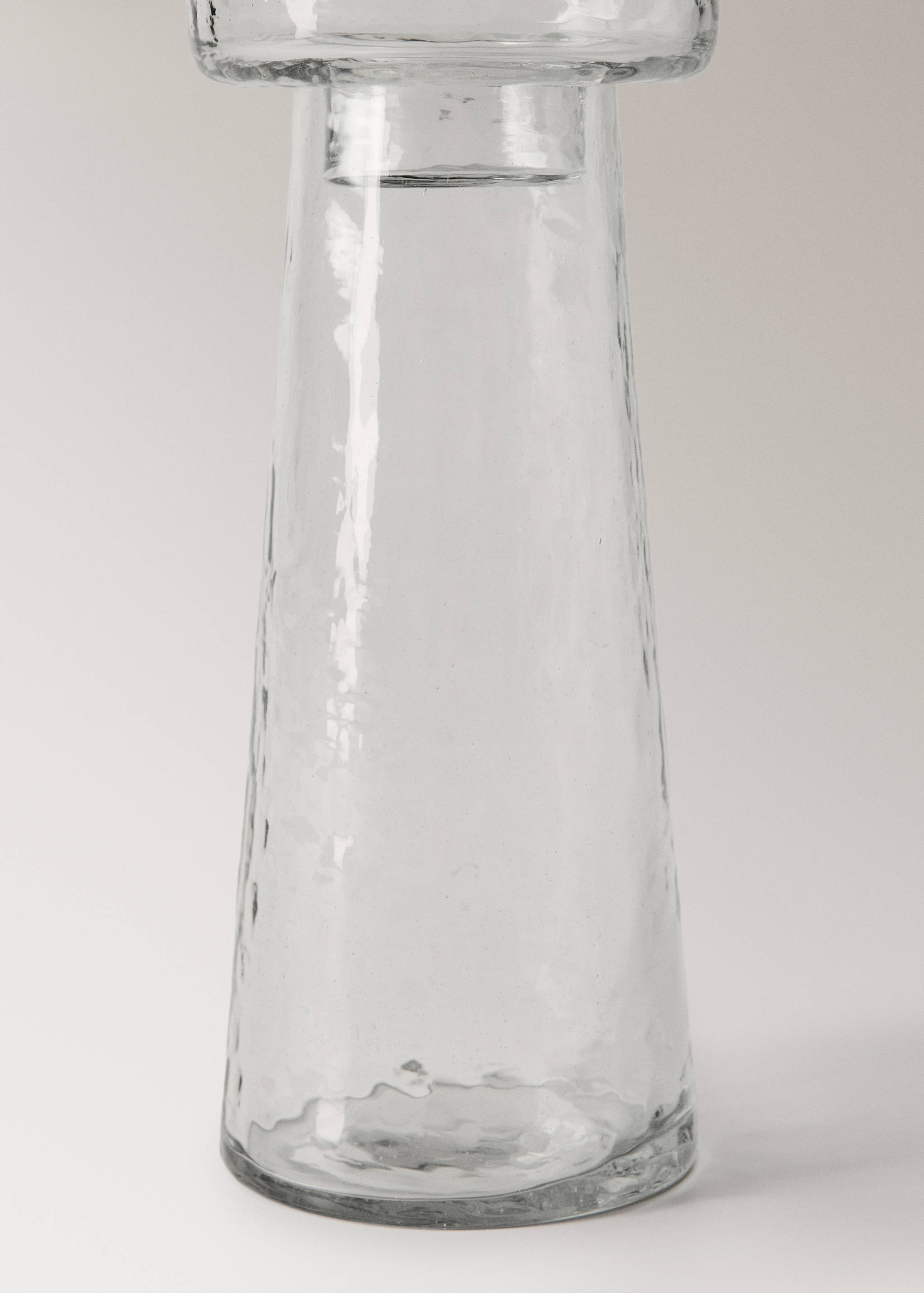 Close-up of a transparent glass candle holder.