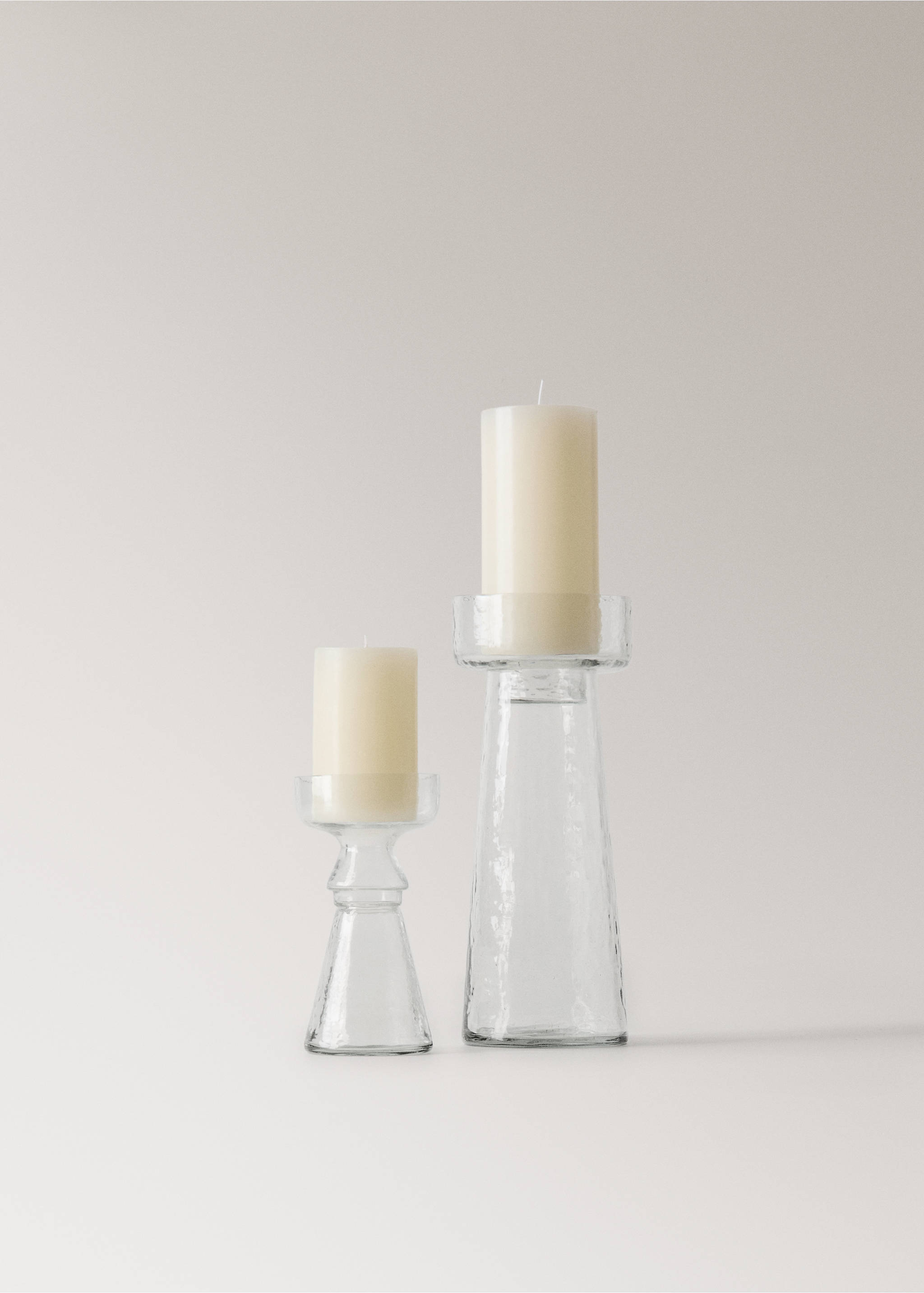 Two clear glass candle holders with cream pillar candles., Black. Ref: 37043294-00.