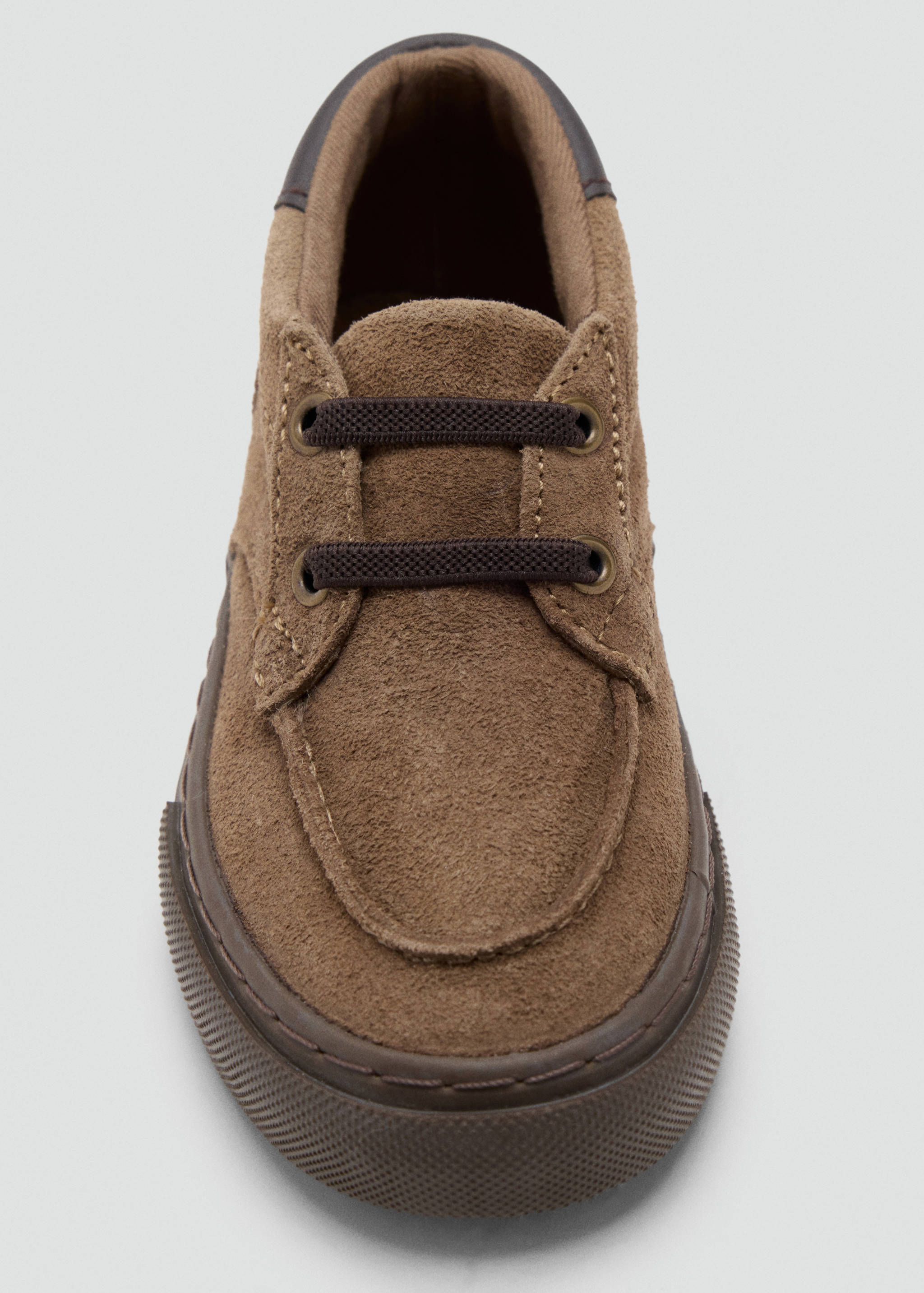 Brown children's suede shoe with elastic laces and moc-toe detail.