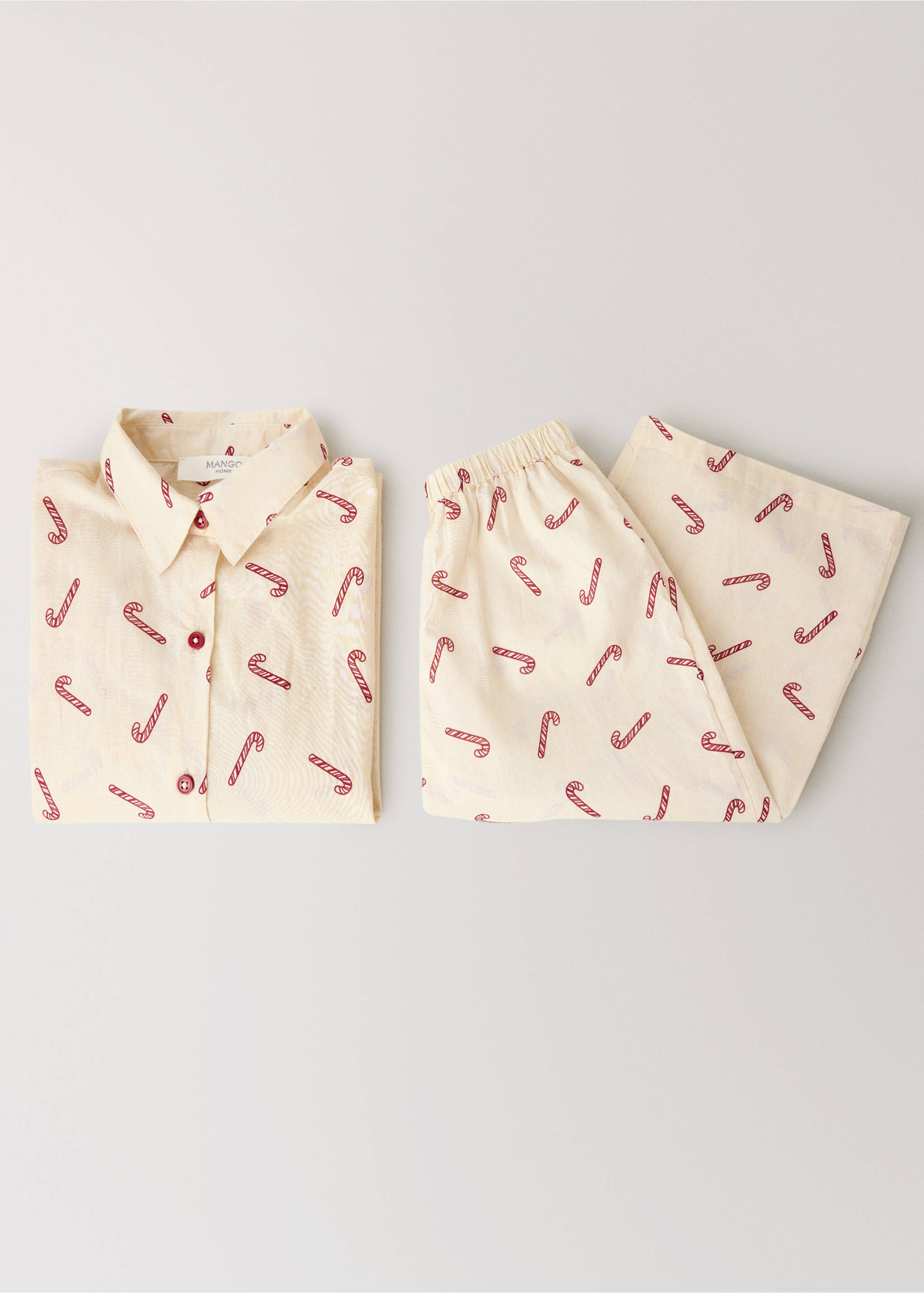 Cream pyjama shirt and trousers set with a red candy cane print., Off White. Ref: 37044452-00.