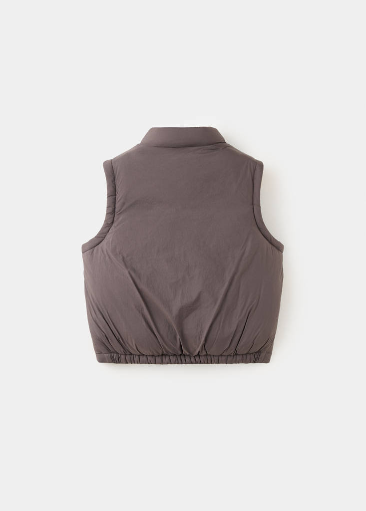 Quilted gilet with pockets — Brown