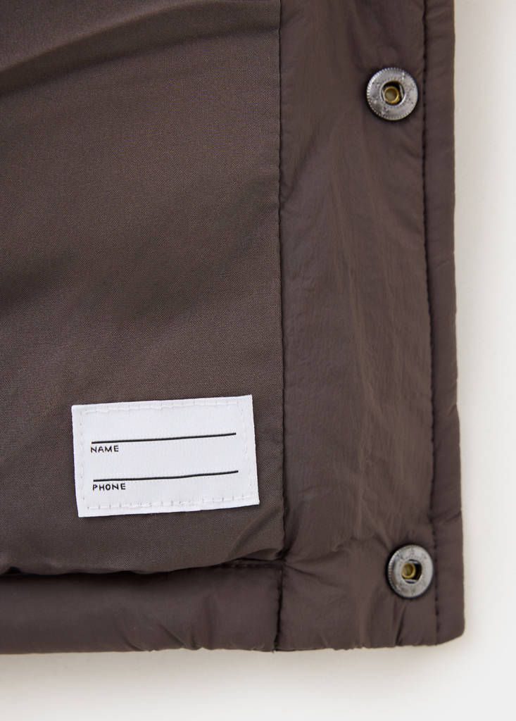 Quilted gilet with pockets — Brown
