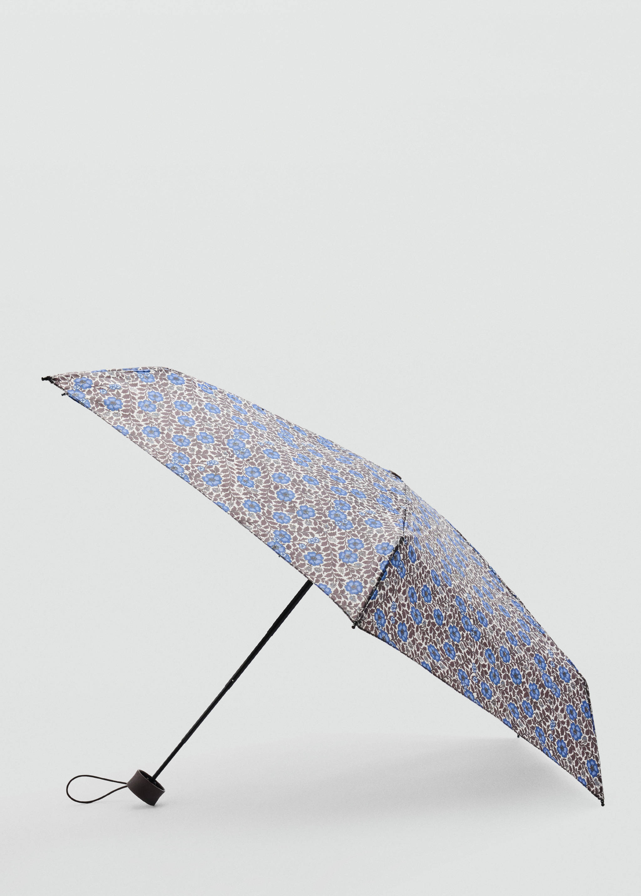 Compact umbrella with a blue floral and brown leaf print.