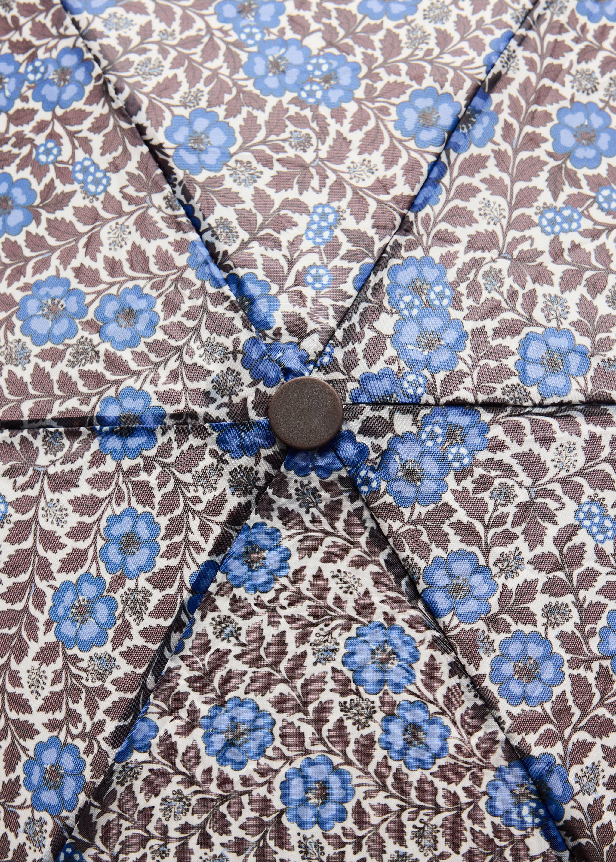 Close-up of a kids' blue floral umbrella top., Chocolate. Ref: 37045157-00.