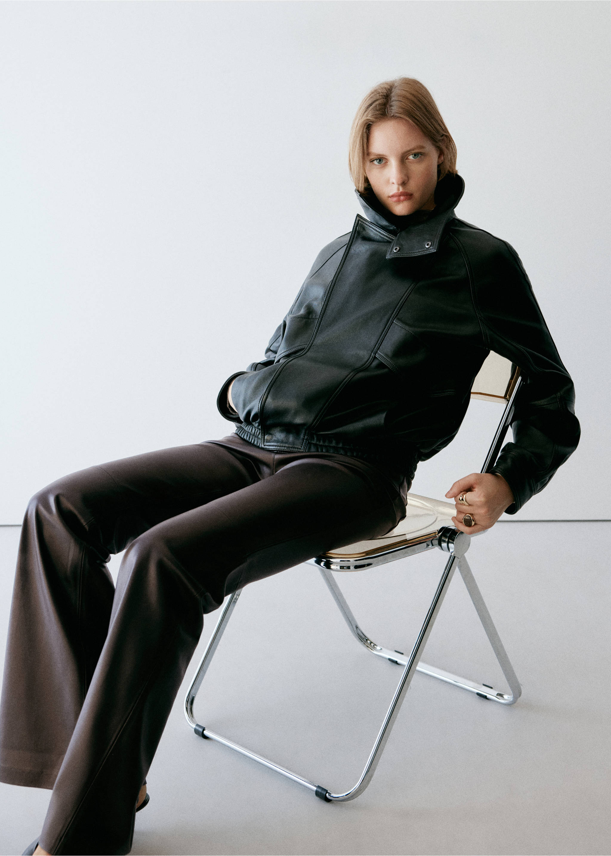 Dark brown trousers worn with a black leather bomber jacket., Chocolate. Ref: 37045163-00.