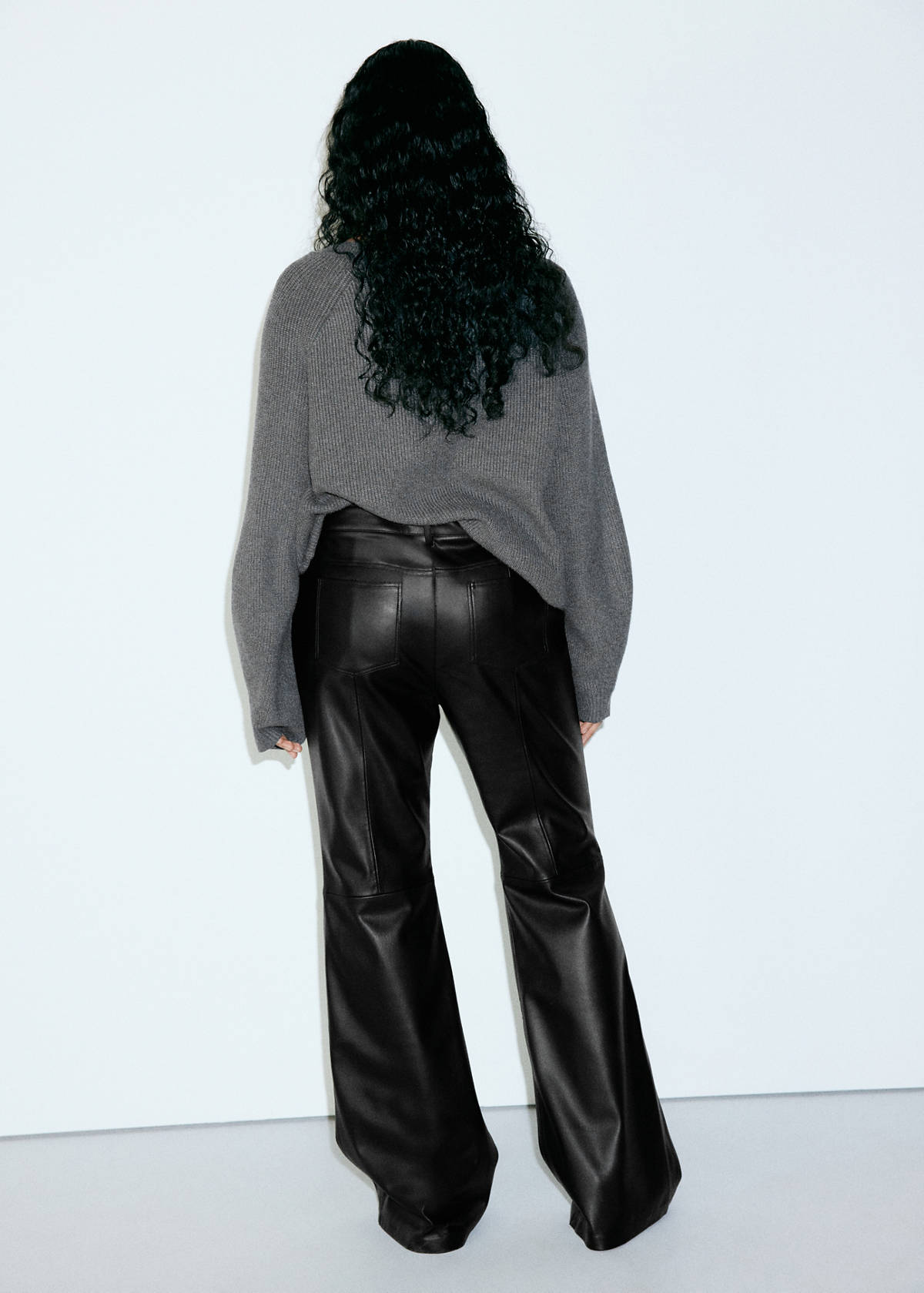 Faux-leather flared trousers — Black