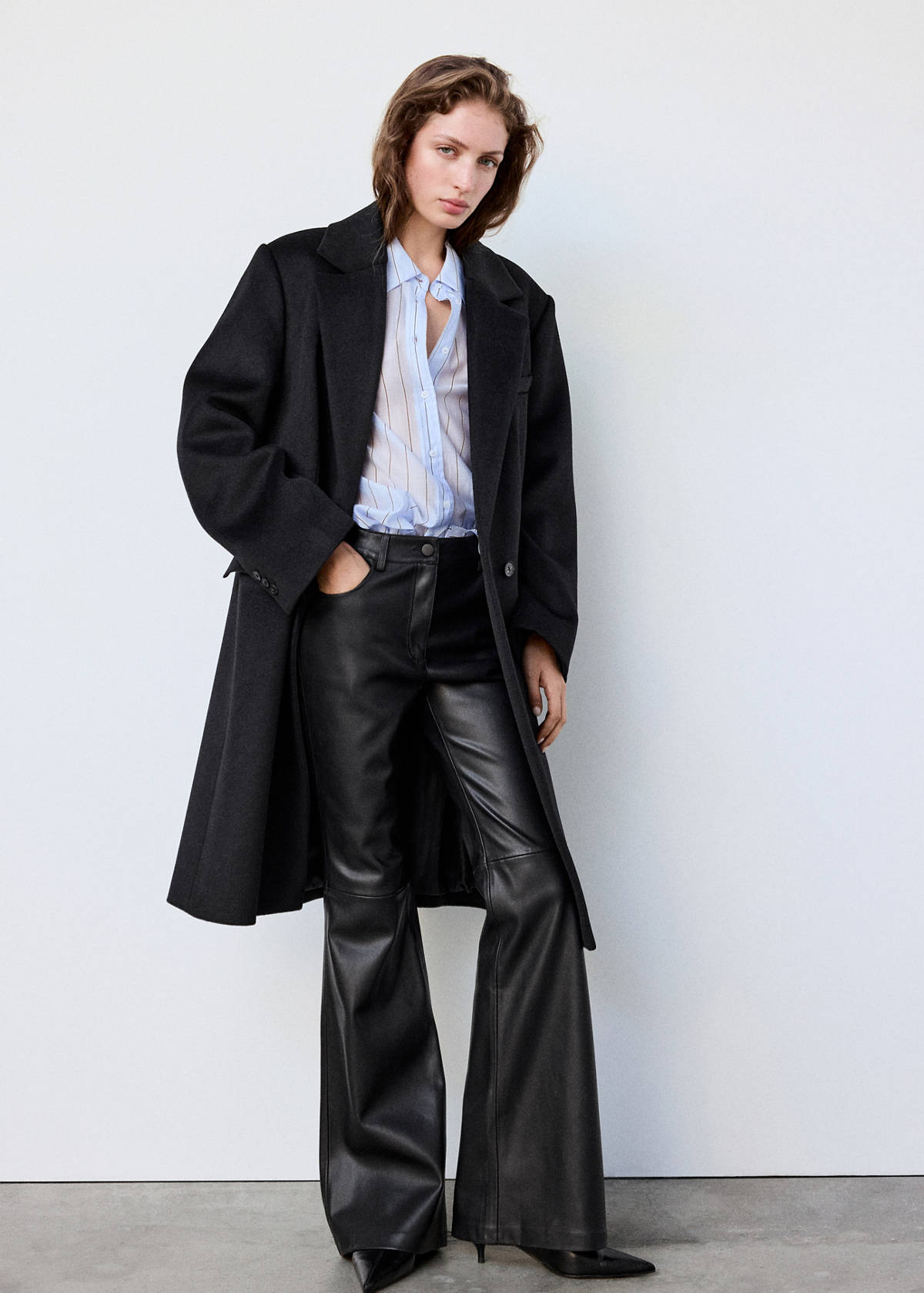 Faux-leather flared trousers — Black