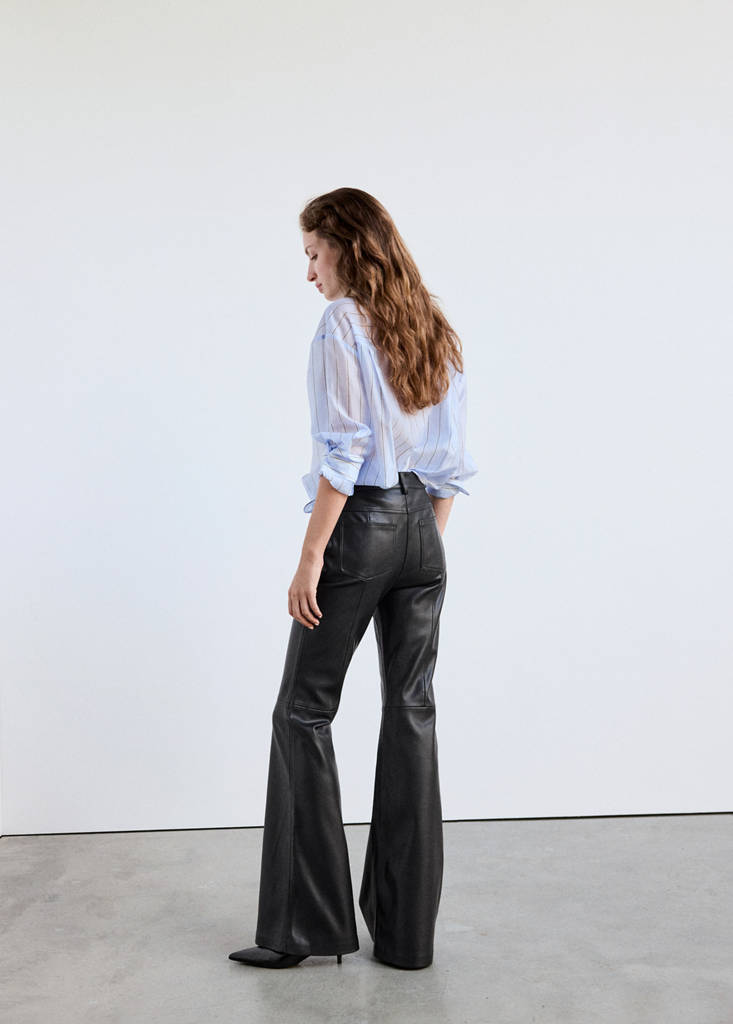 Faux-leather flared trousers — Black