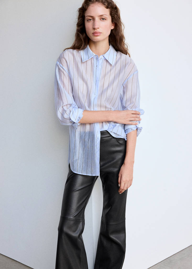 Faux-leather flared trousers — Black
