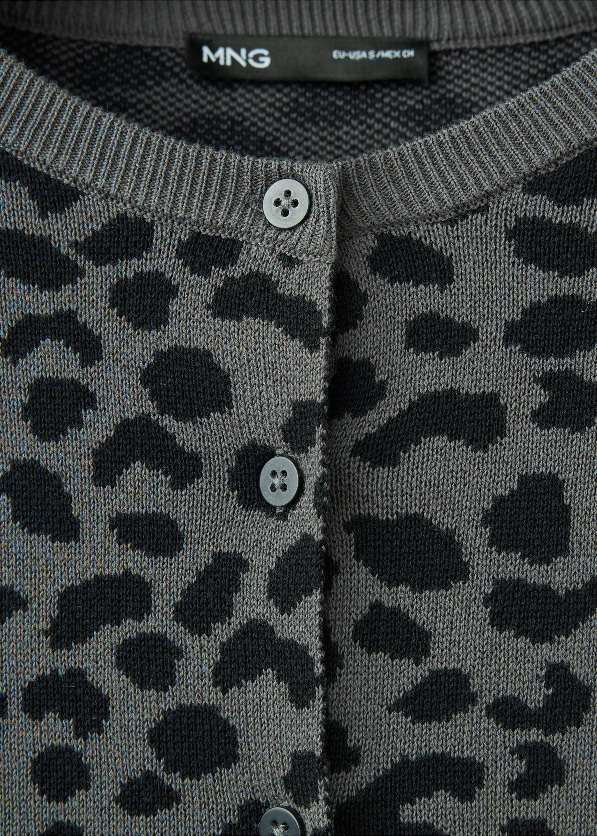 Close-up of a grey animal-print cardigan with a round neck and buttons., Charcoal. Ref: 37045853-00.