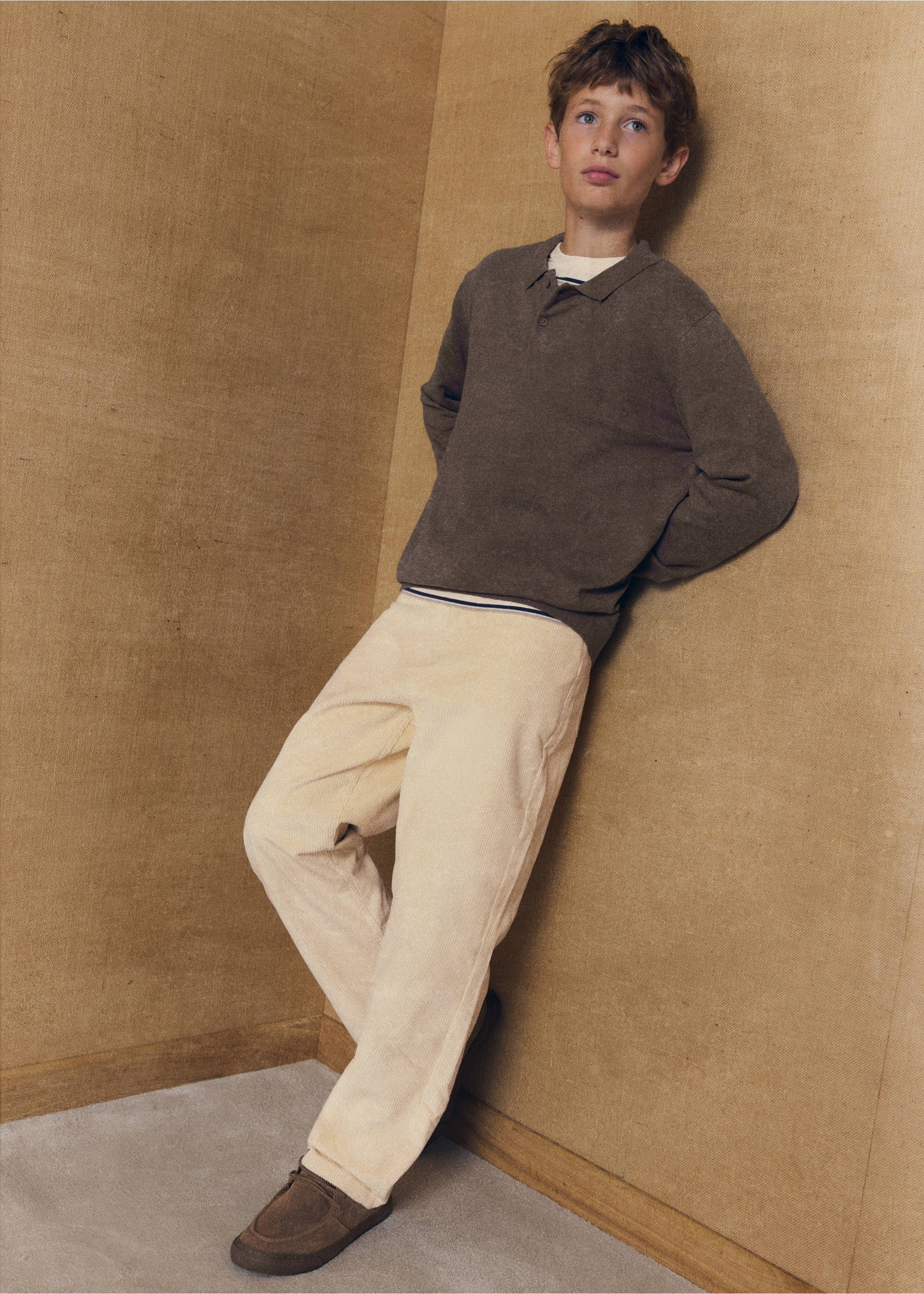 Cream trousers in a straight fit, worn with a brown polo shirt., Ecru. Ref: 37046337-00.