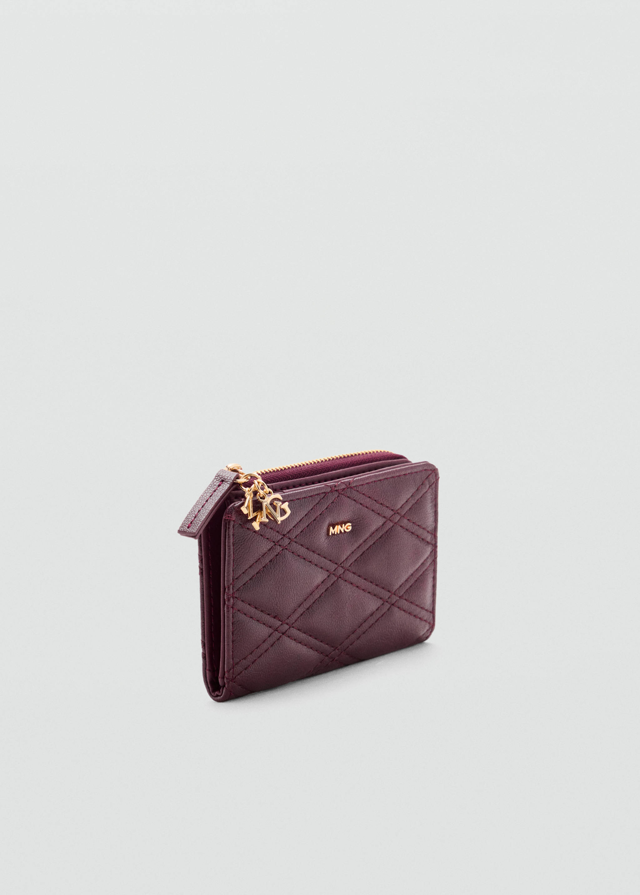 Quilted faux leather wallet with charm detail - Medium plane