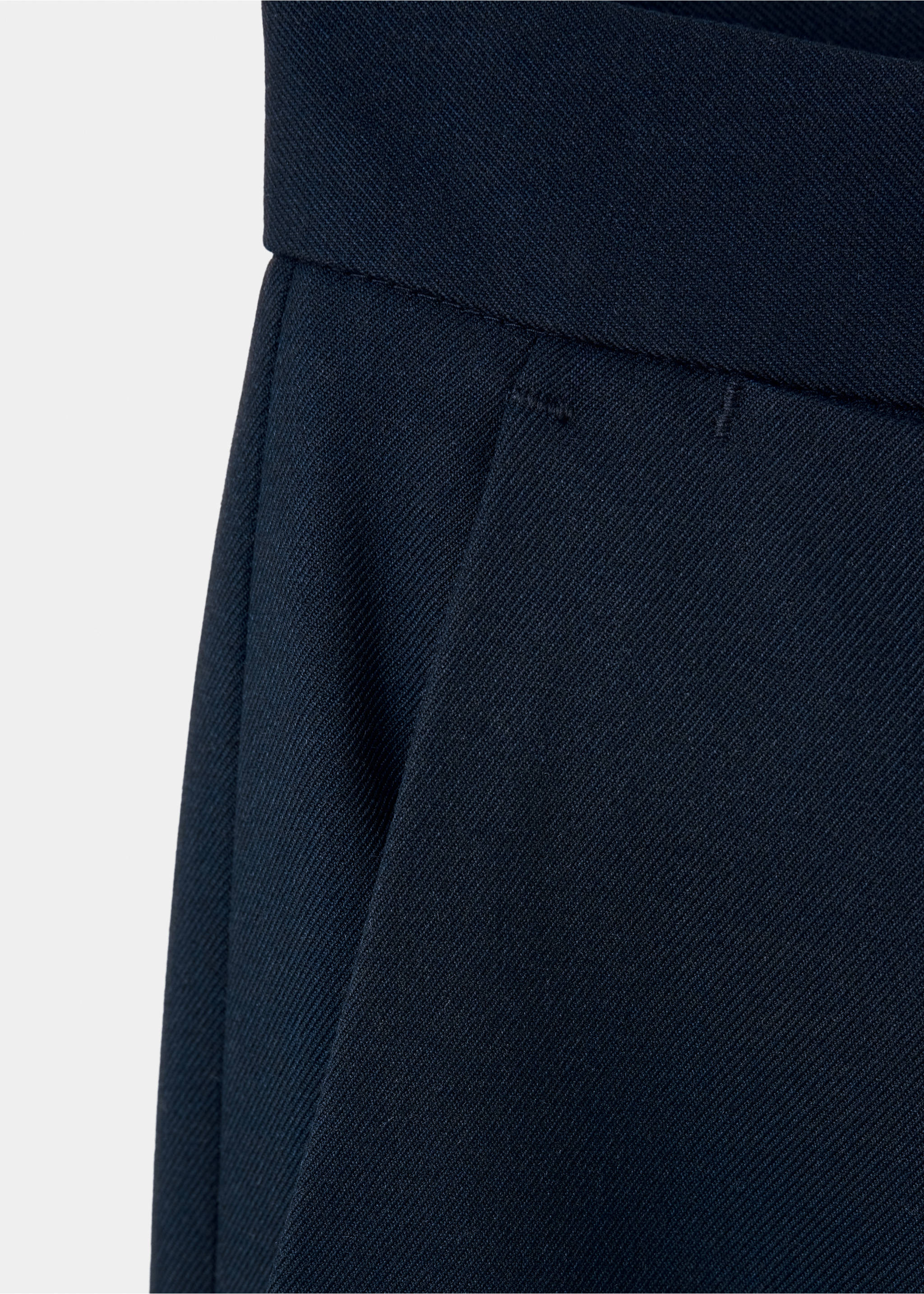 Close-up of the waistband and pocket on dark navy blue trousers., Navy. Ref: 37046737-00.