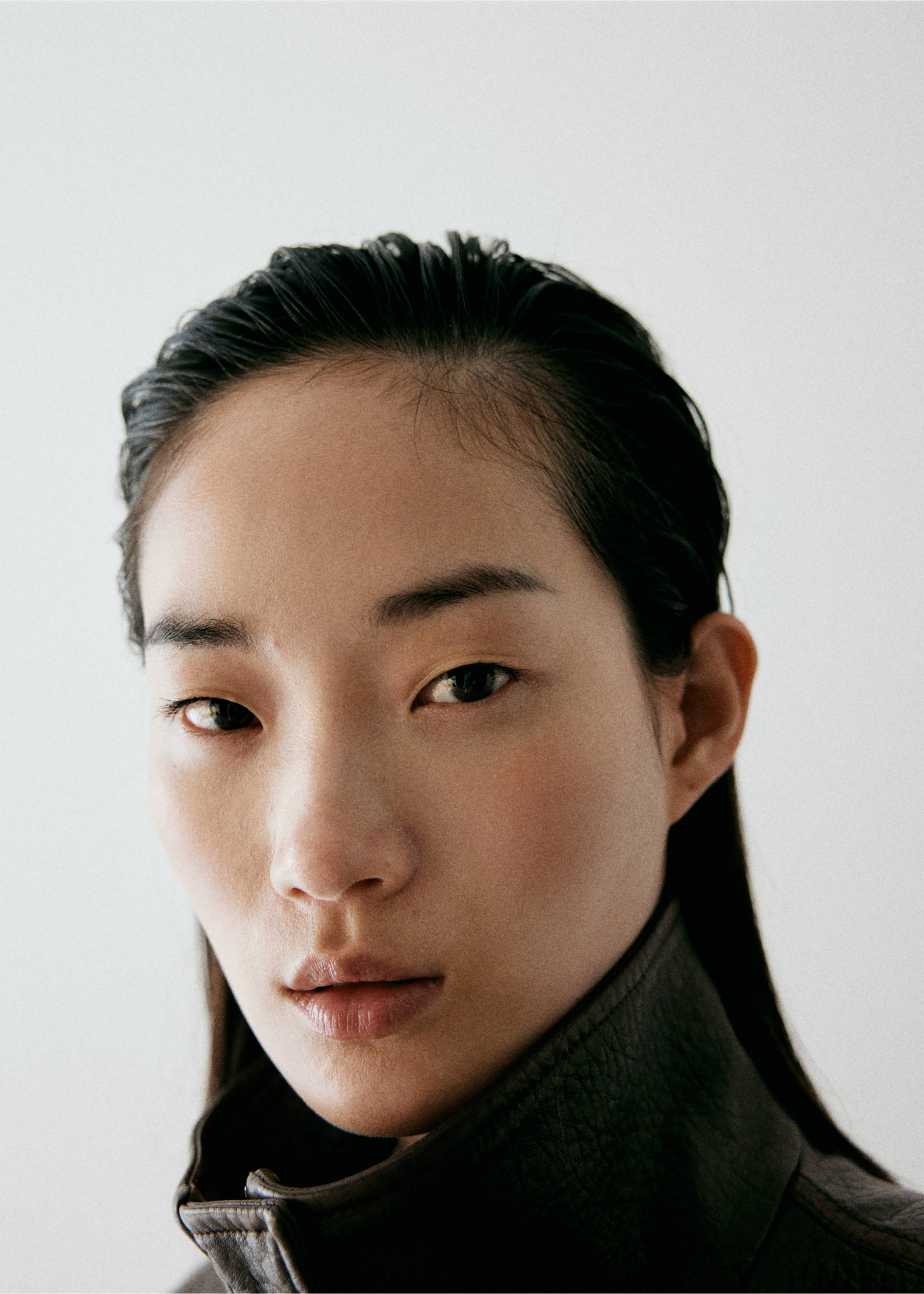 Close-up of a model wearing a dark brown jacket., Khaki. Ref: 37046742-02.