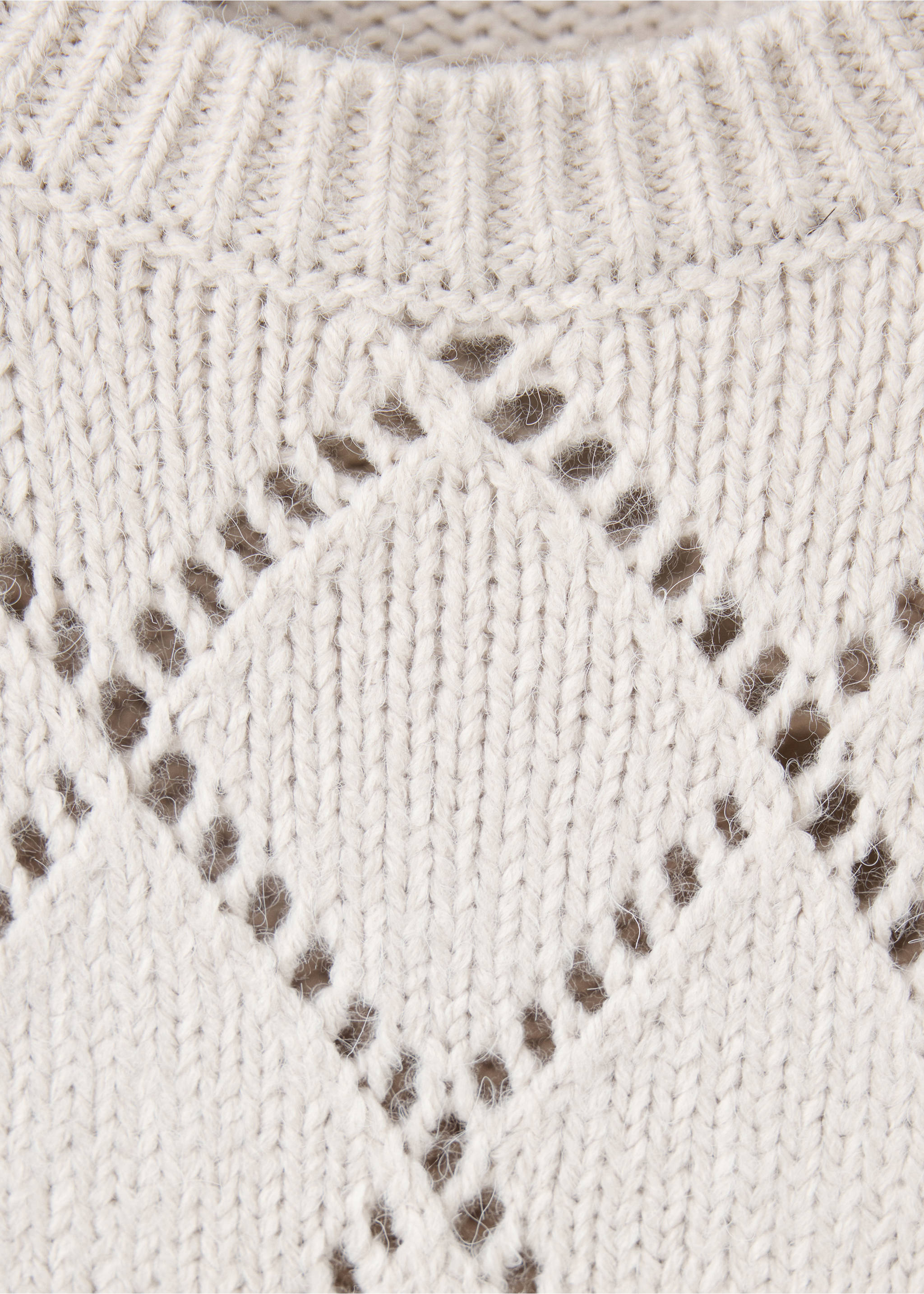 Close-up of a cream knit jumper with an openwork diamond pattern and ribbed round neckline., Sand. Ref: 37047137-00.