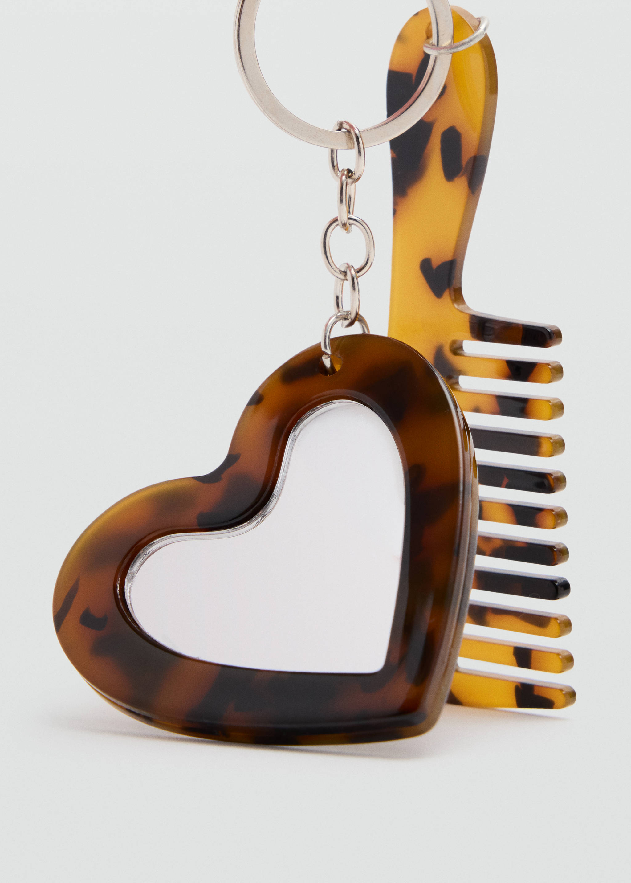 Tortoise-shell heart mirror and comb keychain.