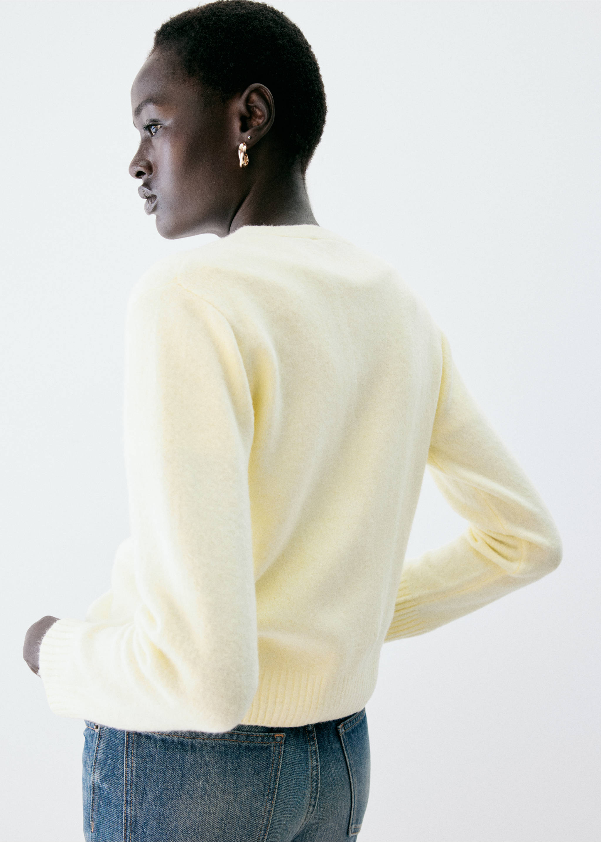 Pale yellow cardigan seen from the back, featuring a round neckline and long sleeves., Pastel Yellow. Ref: 37047774-00.