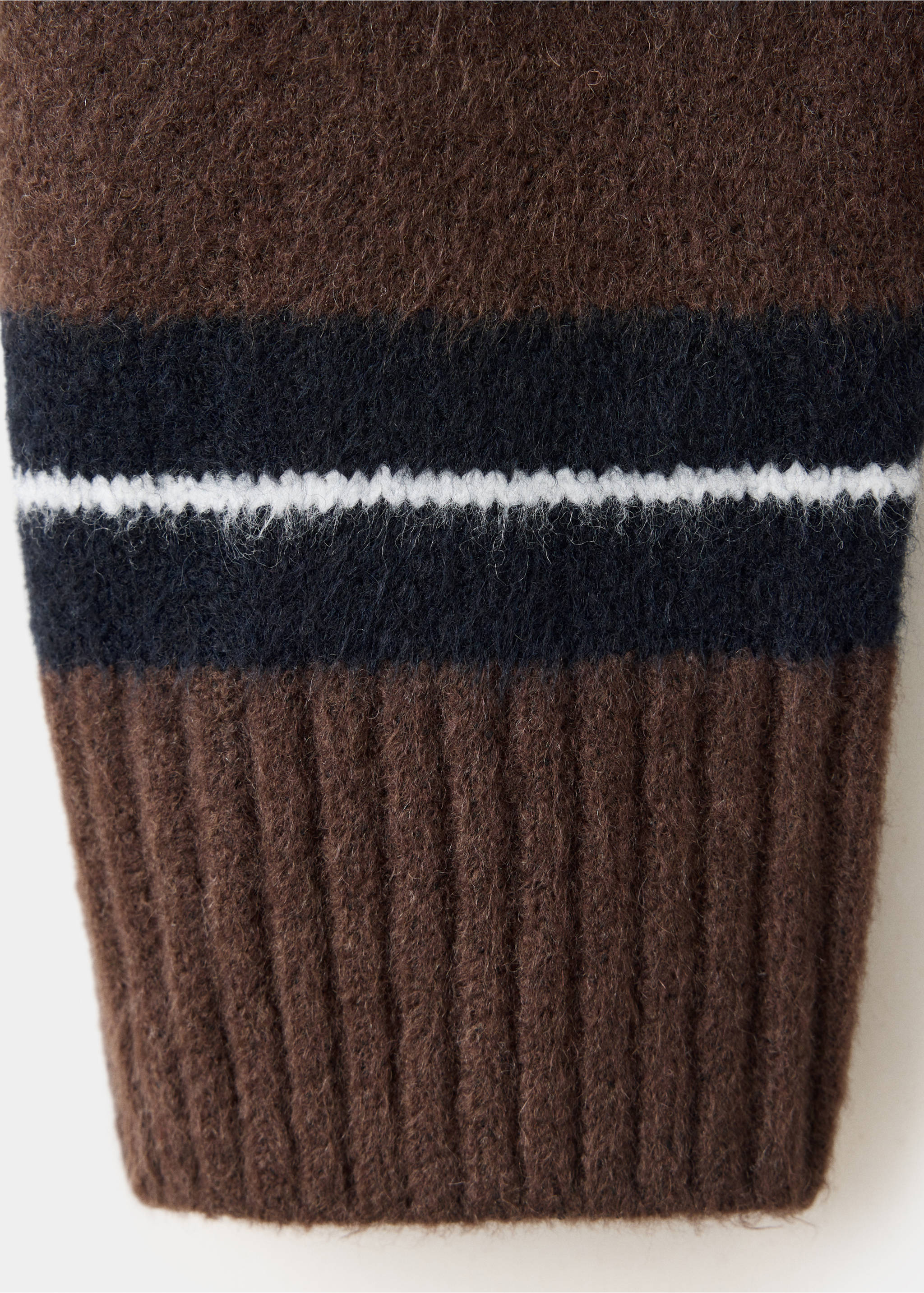 Close-up of a brown fuzzy cardigan with black and white stripes and a ribbed cuff., Brown. Ref: 37047774-00.