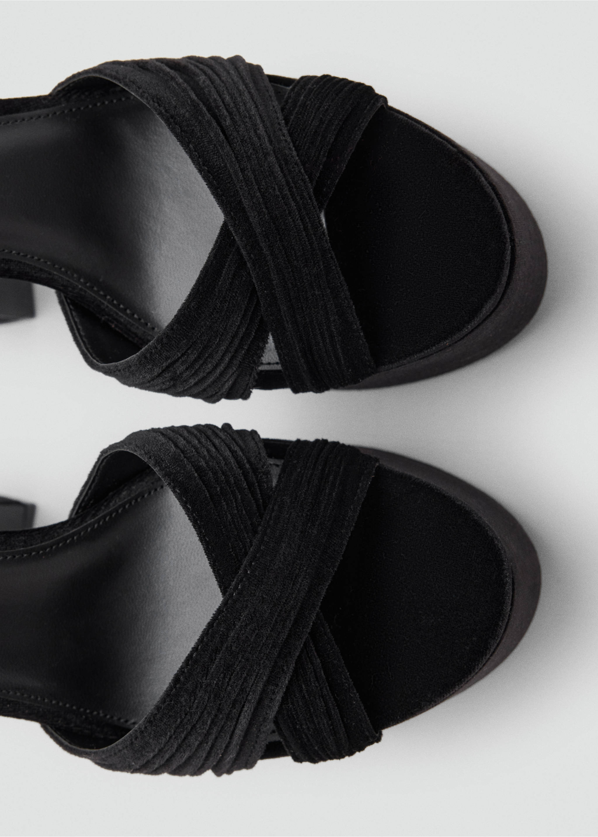 Close-up of black platform sandals with textured crisscross straps., Black. Ref: 37047777-00.