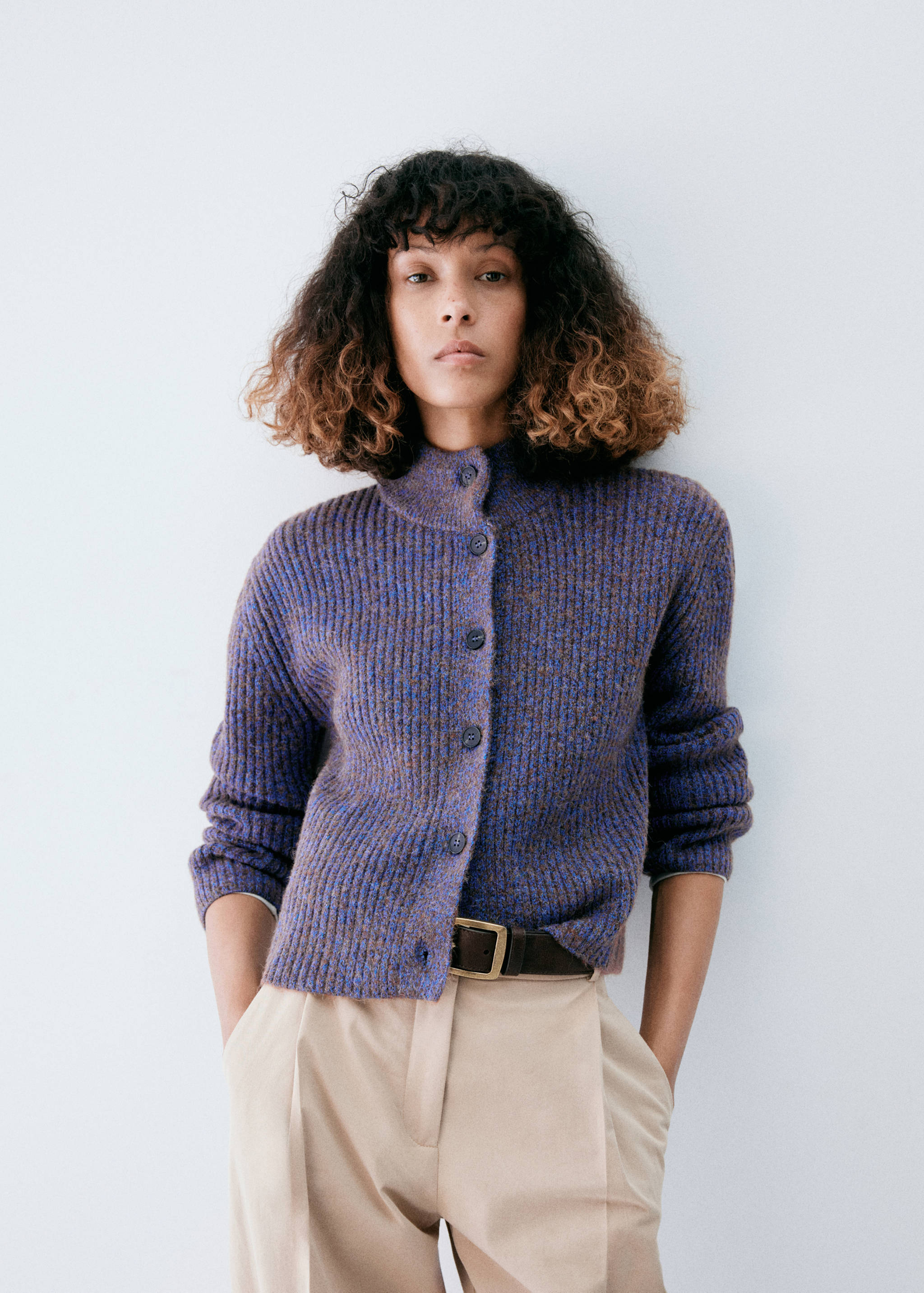 Purple ribbed knit cardigan with a high collar and front buttons.