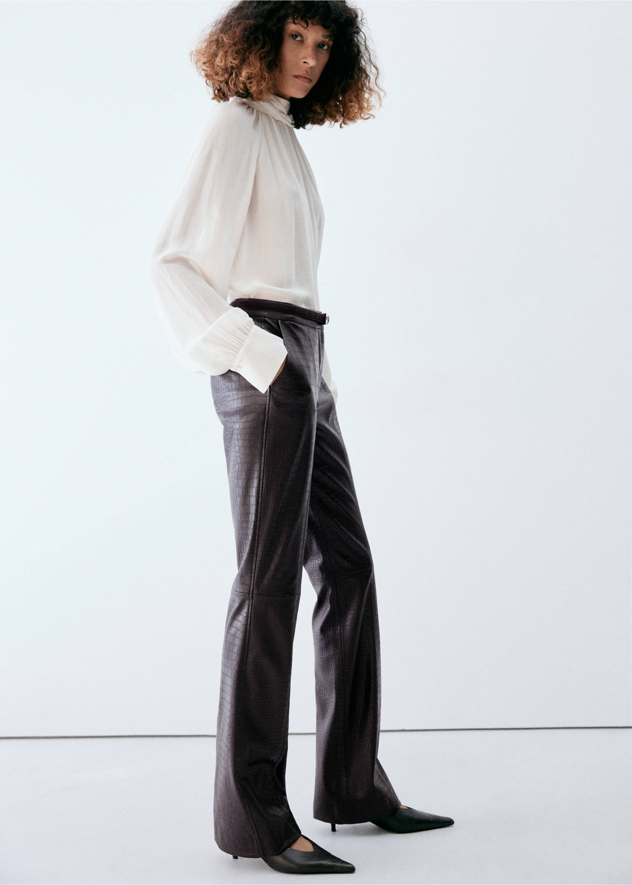 Dark brown embossed straight trousers worn with a white blouse., Chocolate. Ref: 37047789-00.