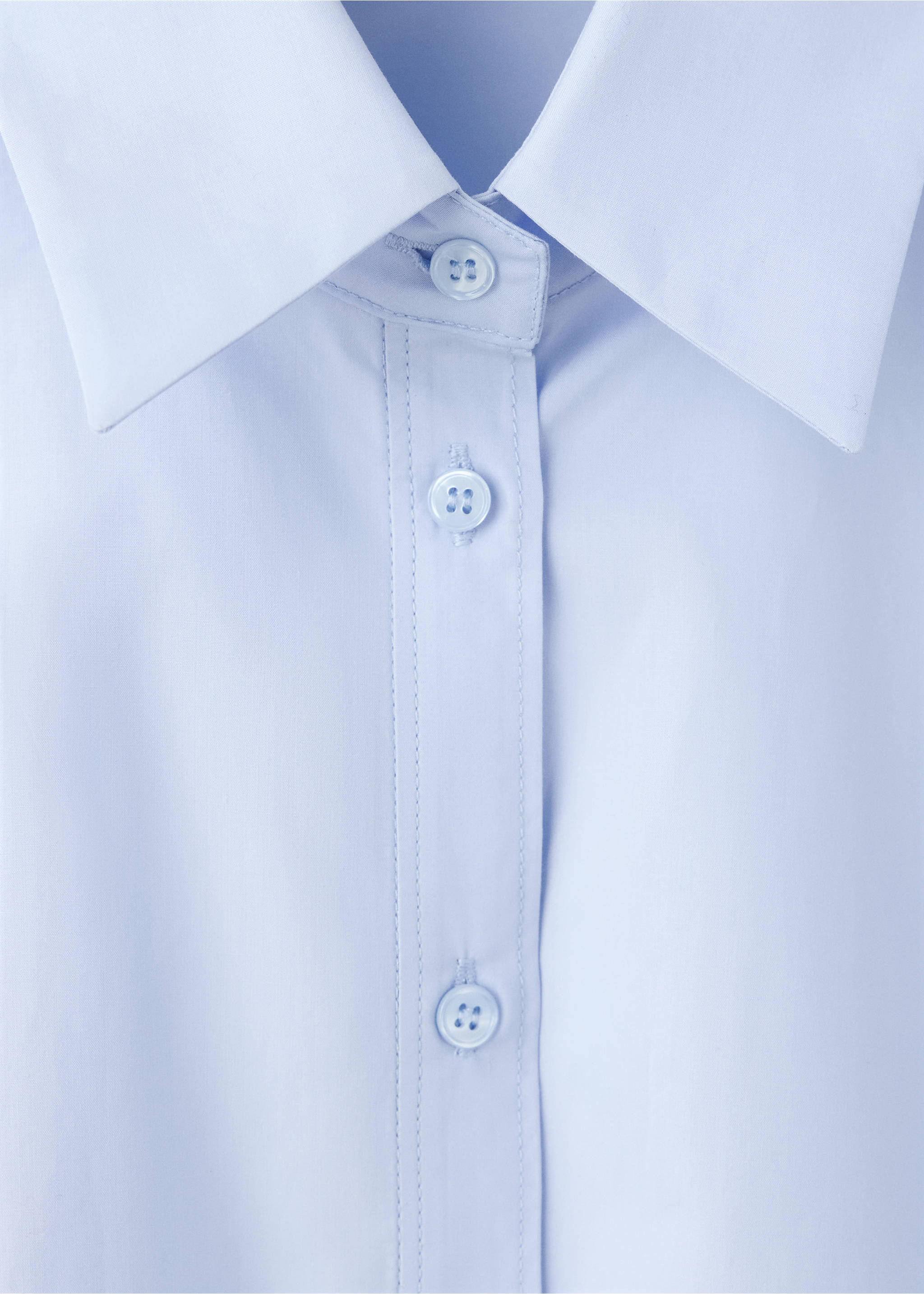 Close-up of a light blue shirt collar and button placket., Sky Blue. Ref: 37047793-00.