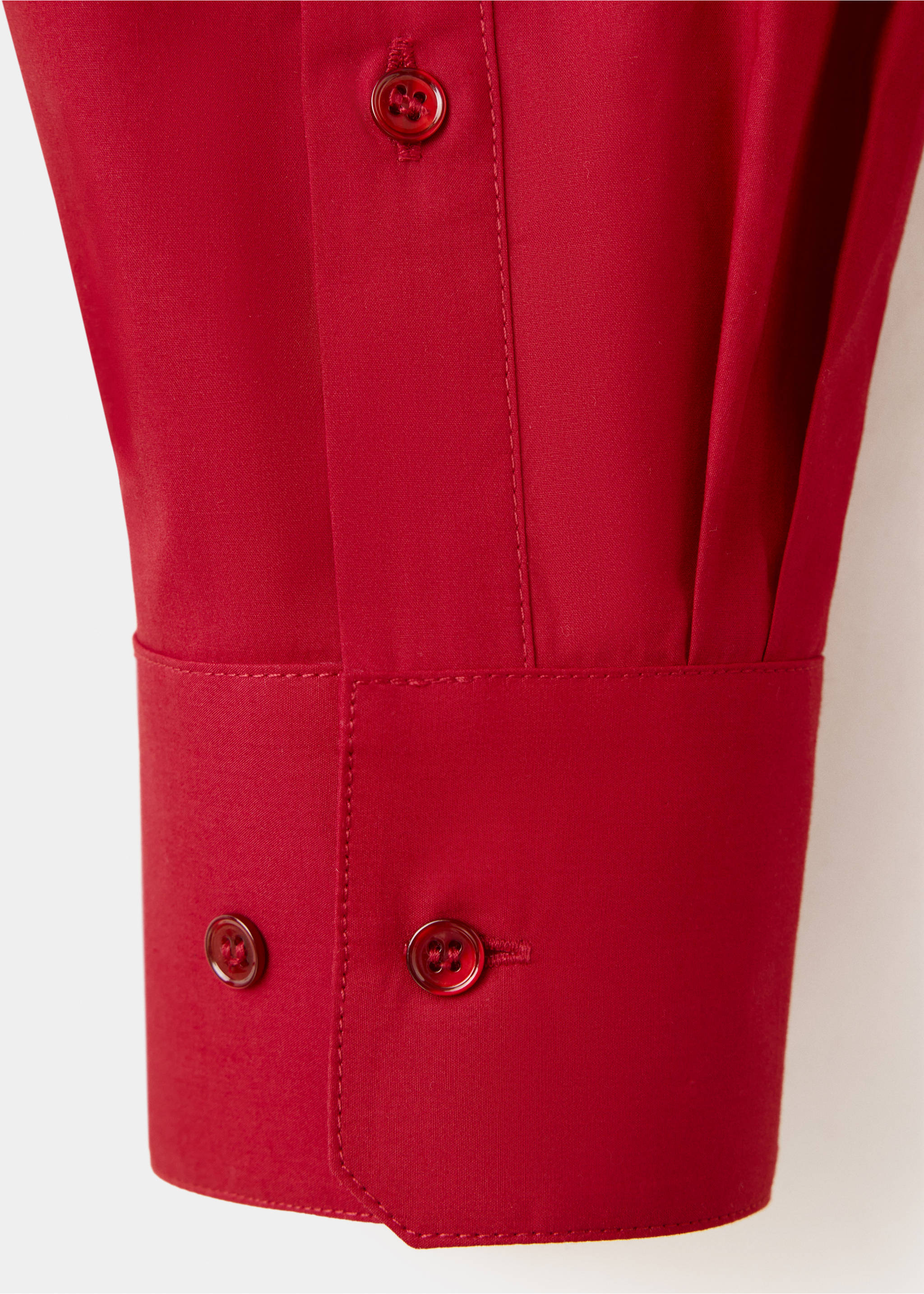 Close-up of a red shirt cuff with matching buttons and tonal stitching., Red. Ref: 37047793-00.