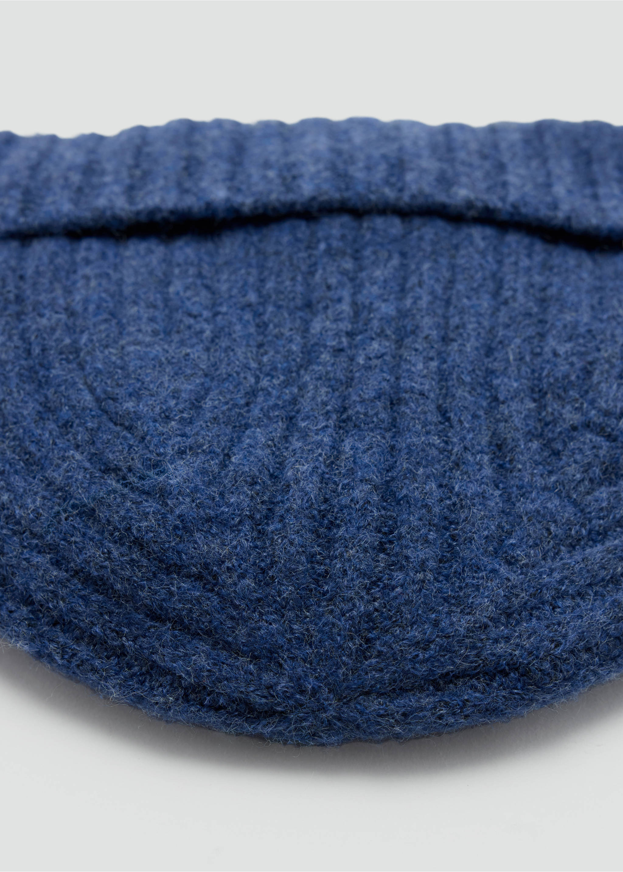Close-up of a dark blue knitted hat with a ribbed texture and folded brim., Navy. Ref: 37047804-00.
