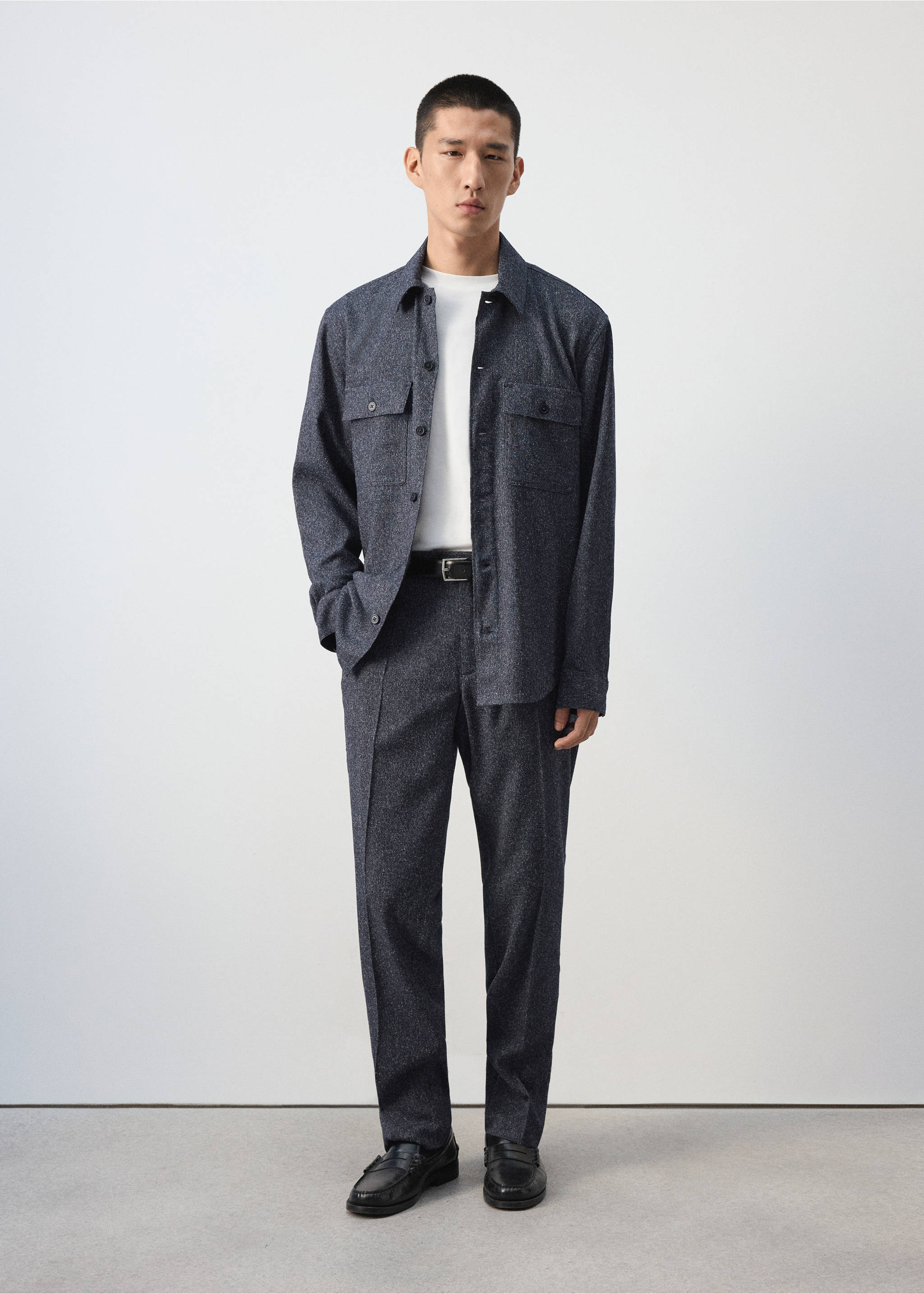 Dark grey speckled trousers worn with a matching overshirt and a white t-shirt., Navy. Ref: 37047885-00.