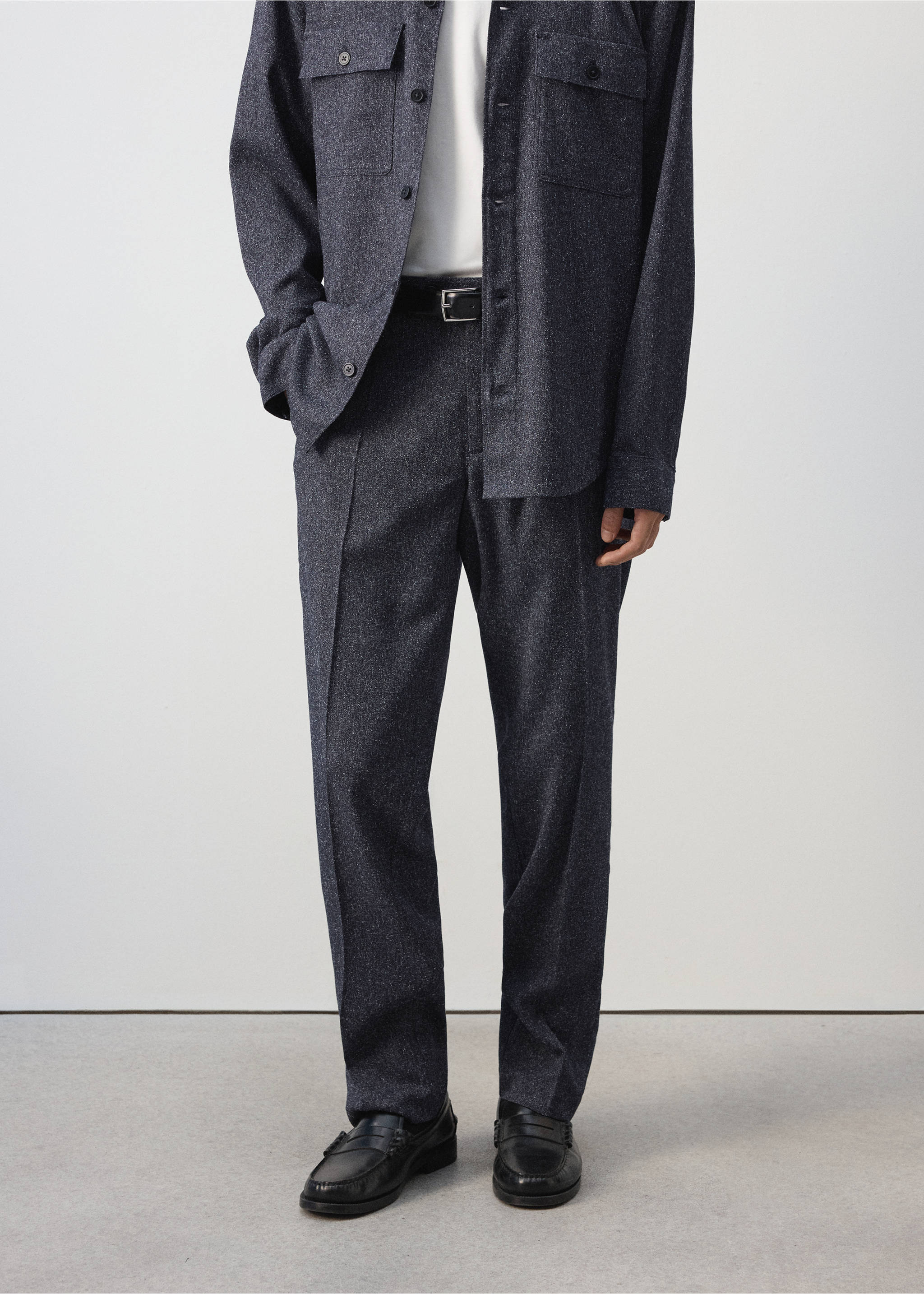 Dark grey melange straight trousers with pressed creases and a black leather belt., Navy. Ref: 37047885-00.