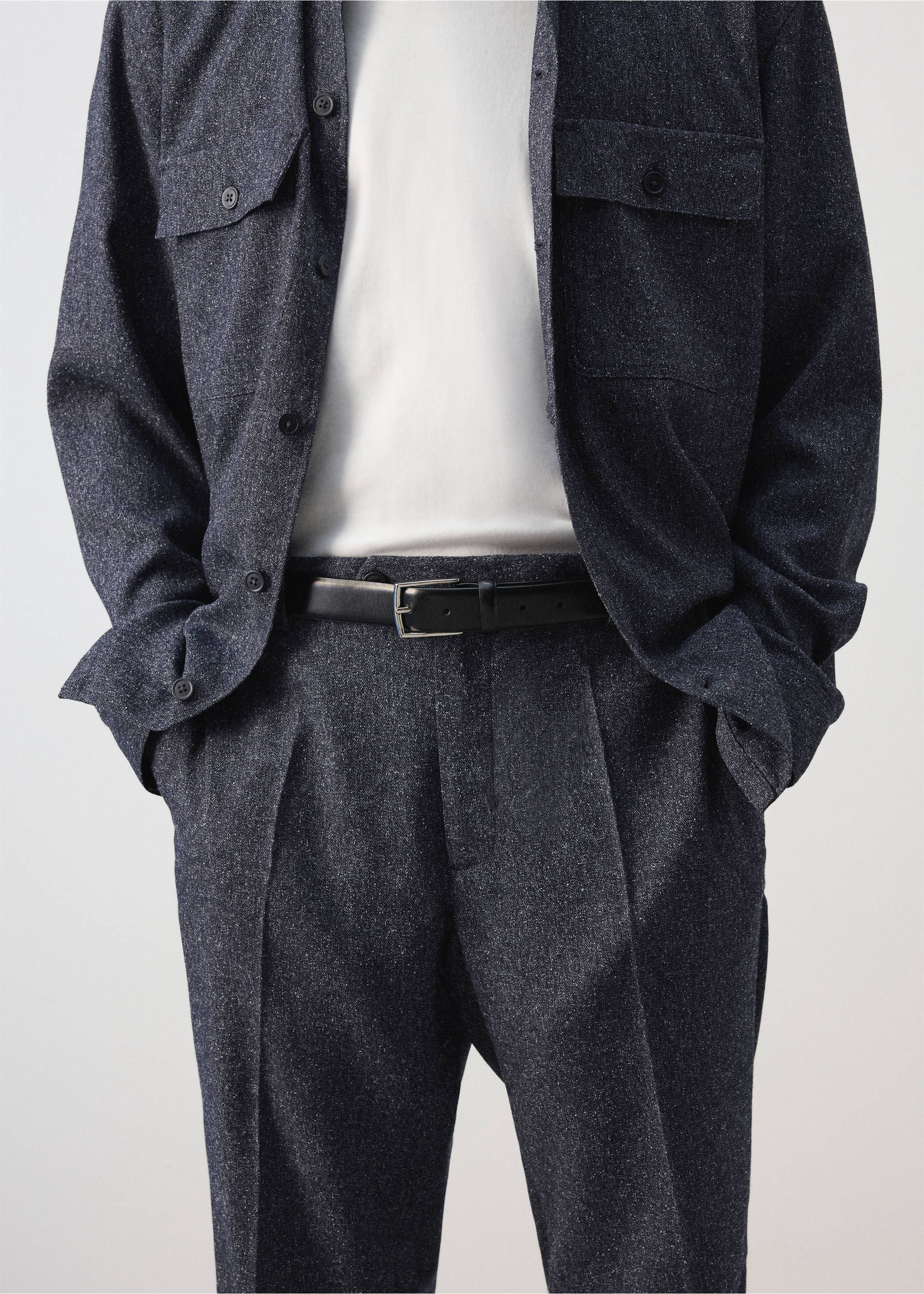 Dark grey pleated trousers worn with a black leather belt and matching overshirt., Navy. Ref: 37047885-00.