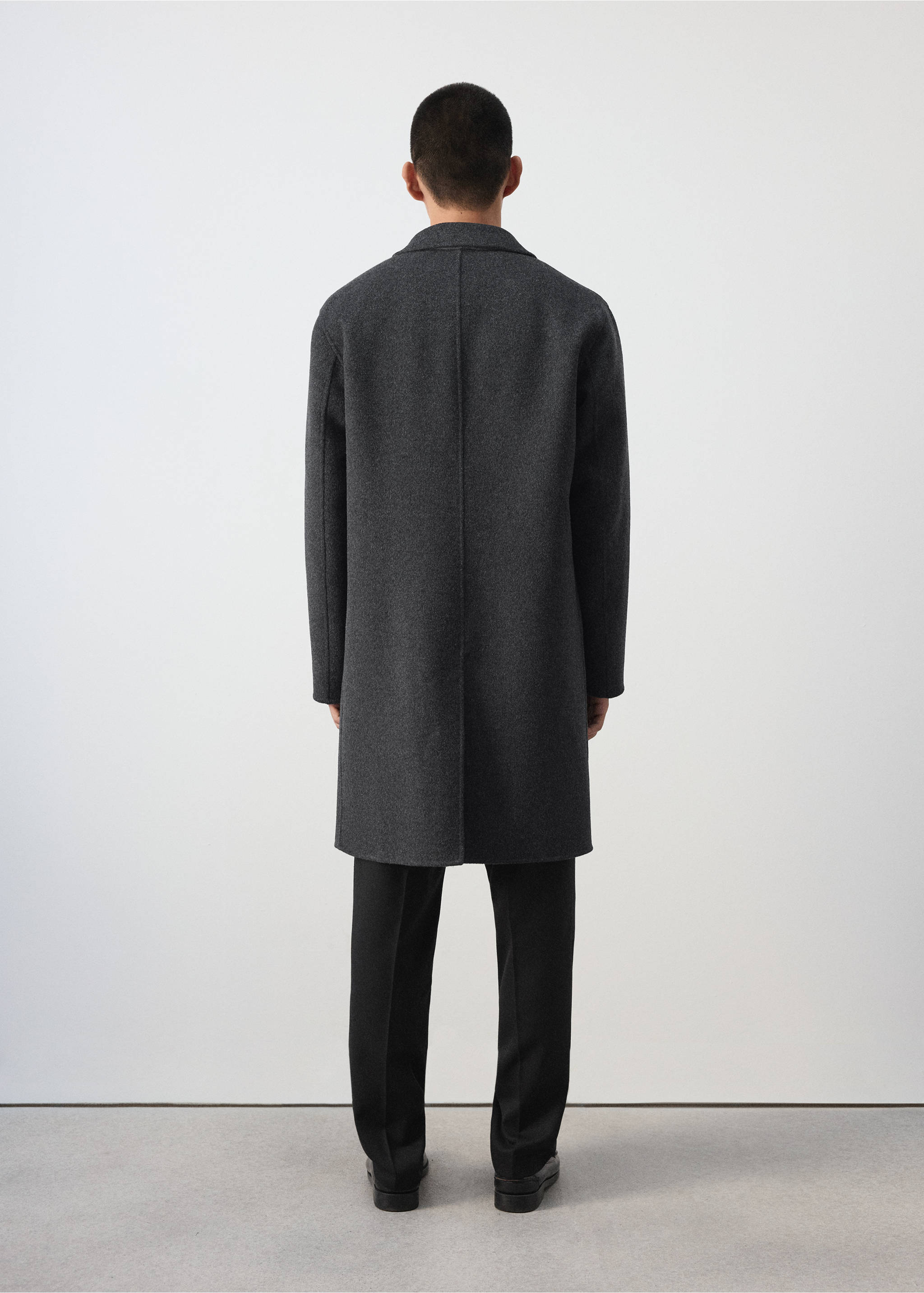 Back view of a dark grey coat with a lapel collar., Charcoal. Ref: 37047886-00.