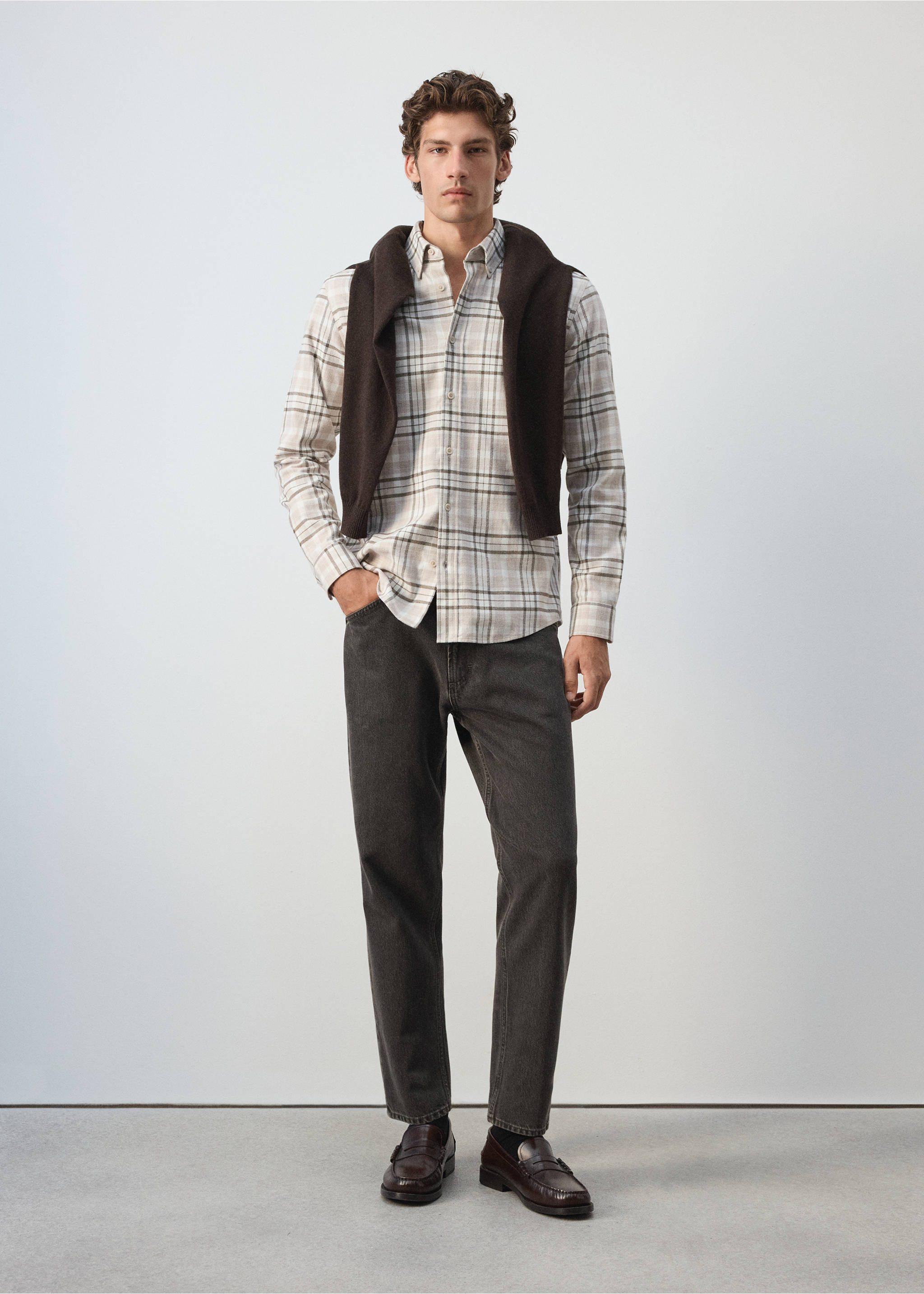 Beige and grey plaid overshirt worn with a dark knit sweater draped over the shoulders., Light/Pastel Grey. Ref: 37047893-00.