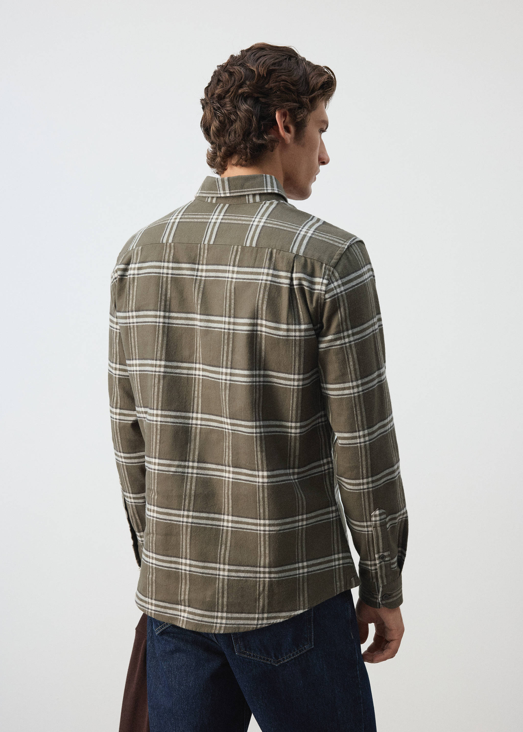 Olive green plaid overshirt seen from the back, featuring a classic collar and long sleeves.