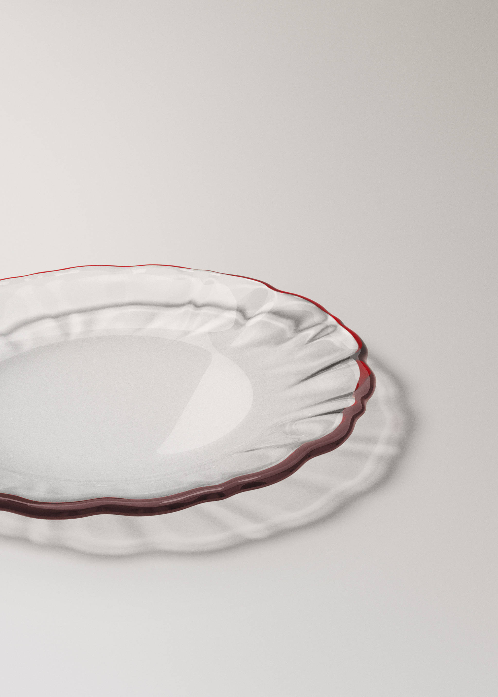 Clear glass plates with a wavy rim and dark red border.