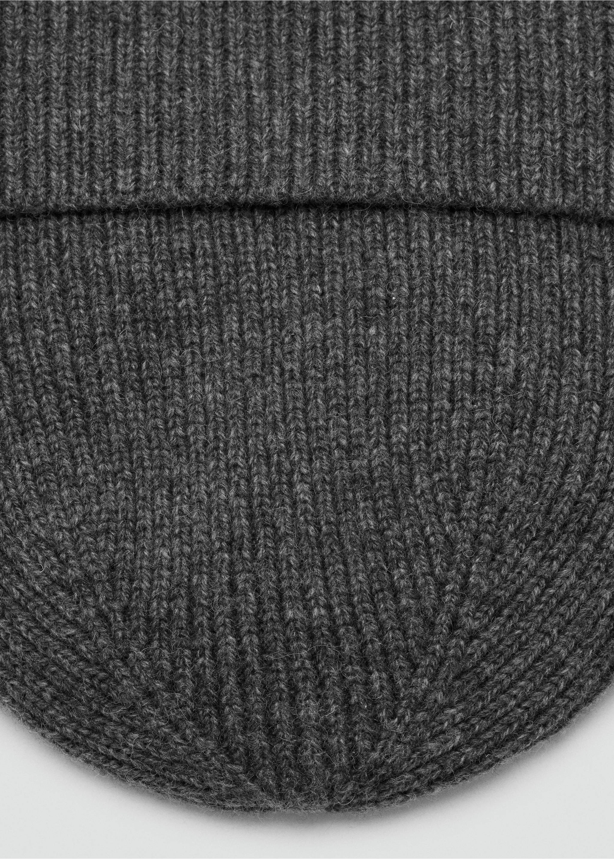 Close-up of a dark grey knitted beanie showing the ribbed texture., Grey. Ref: 37047903-00.