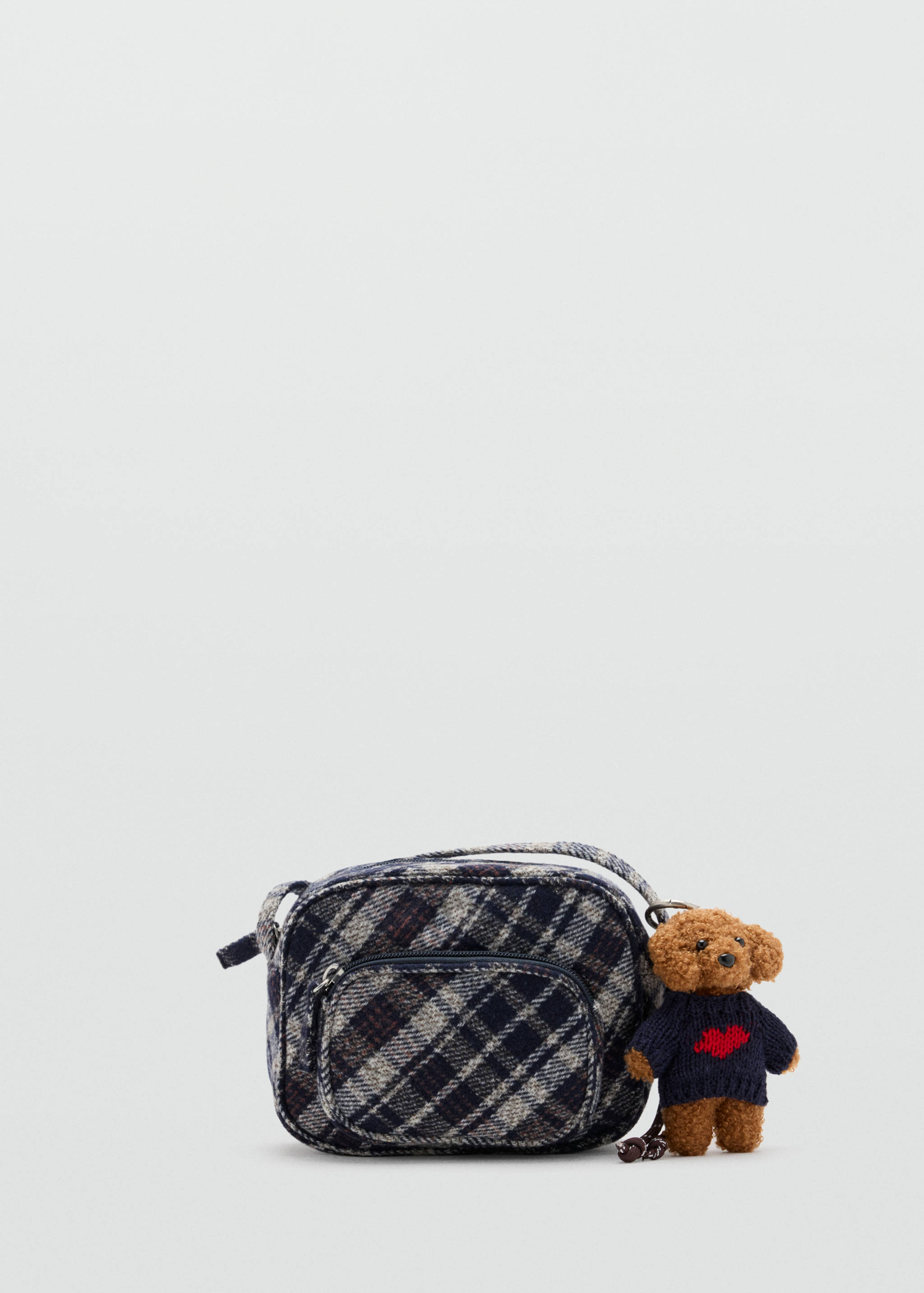 Navy blue and cream plaid mini bag with a front pocket and a teddy bear charm.