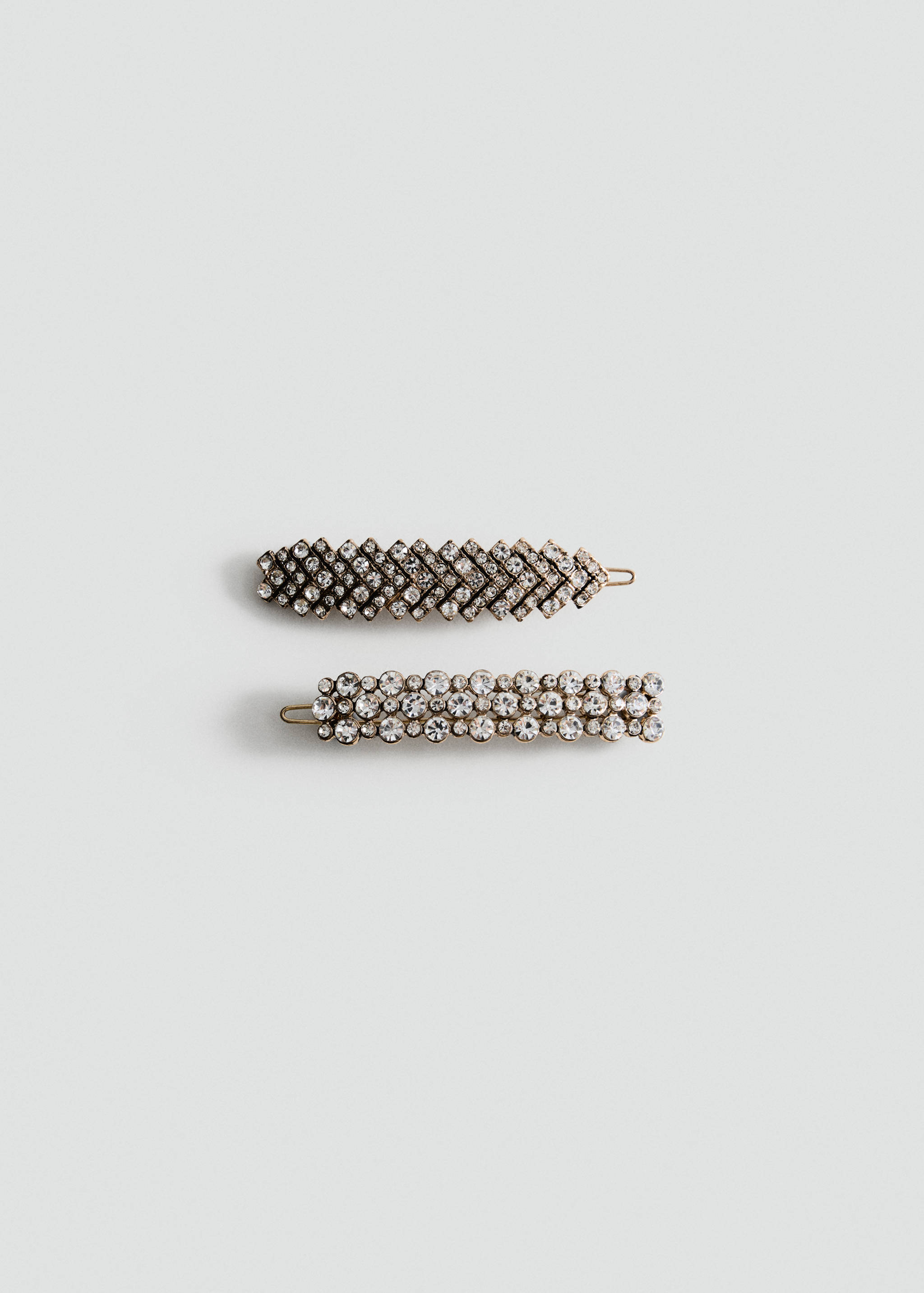 Two rhinestone-embellished hair clips featuring geometric and round crystal designs.