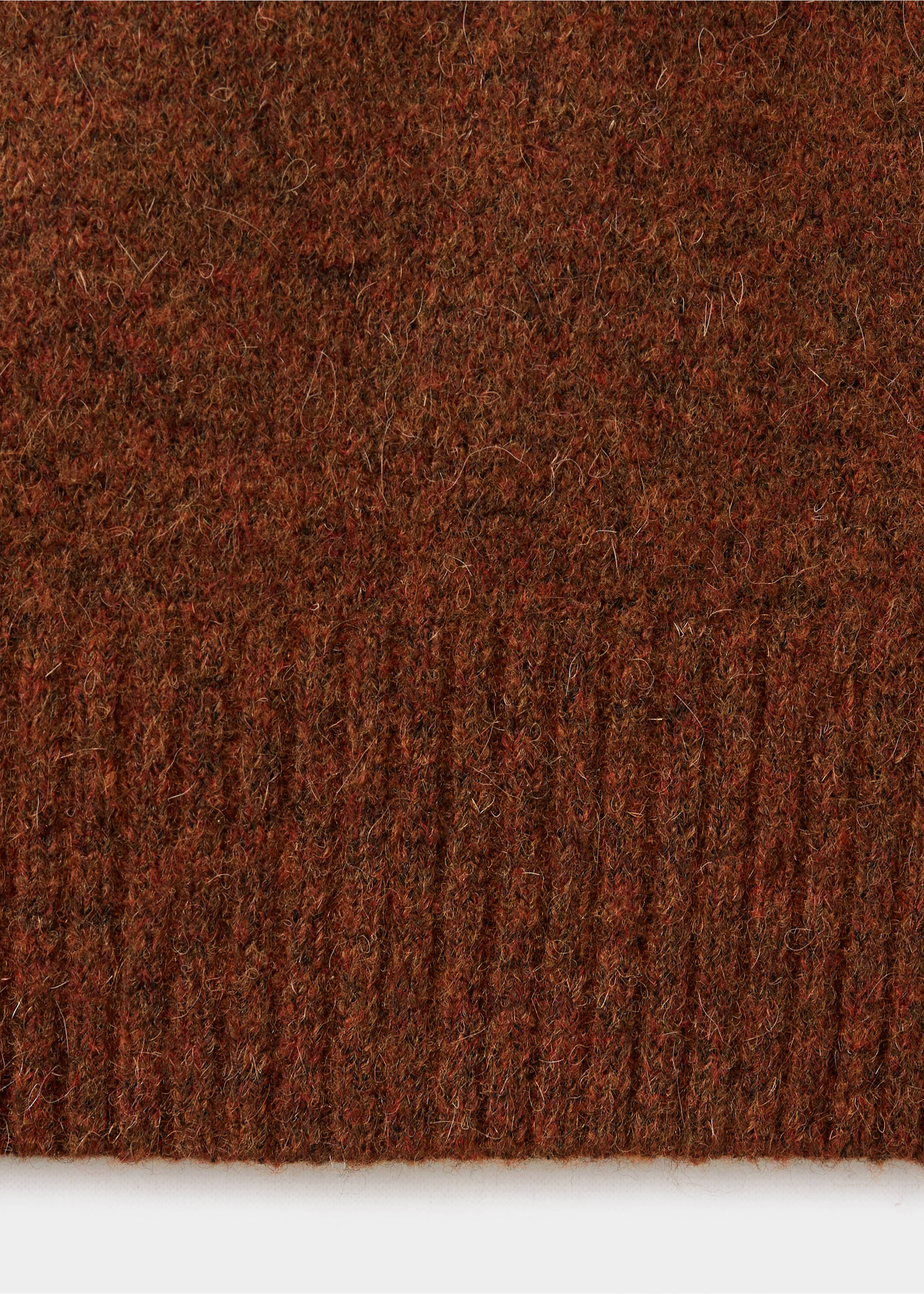 Brown knit polo fabric close-up with texture detail., Burnt Orange. Ref: 37047916-00.