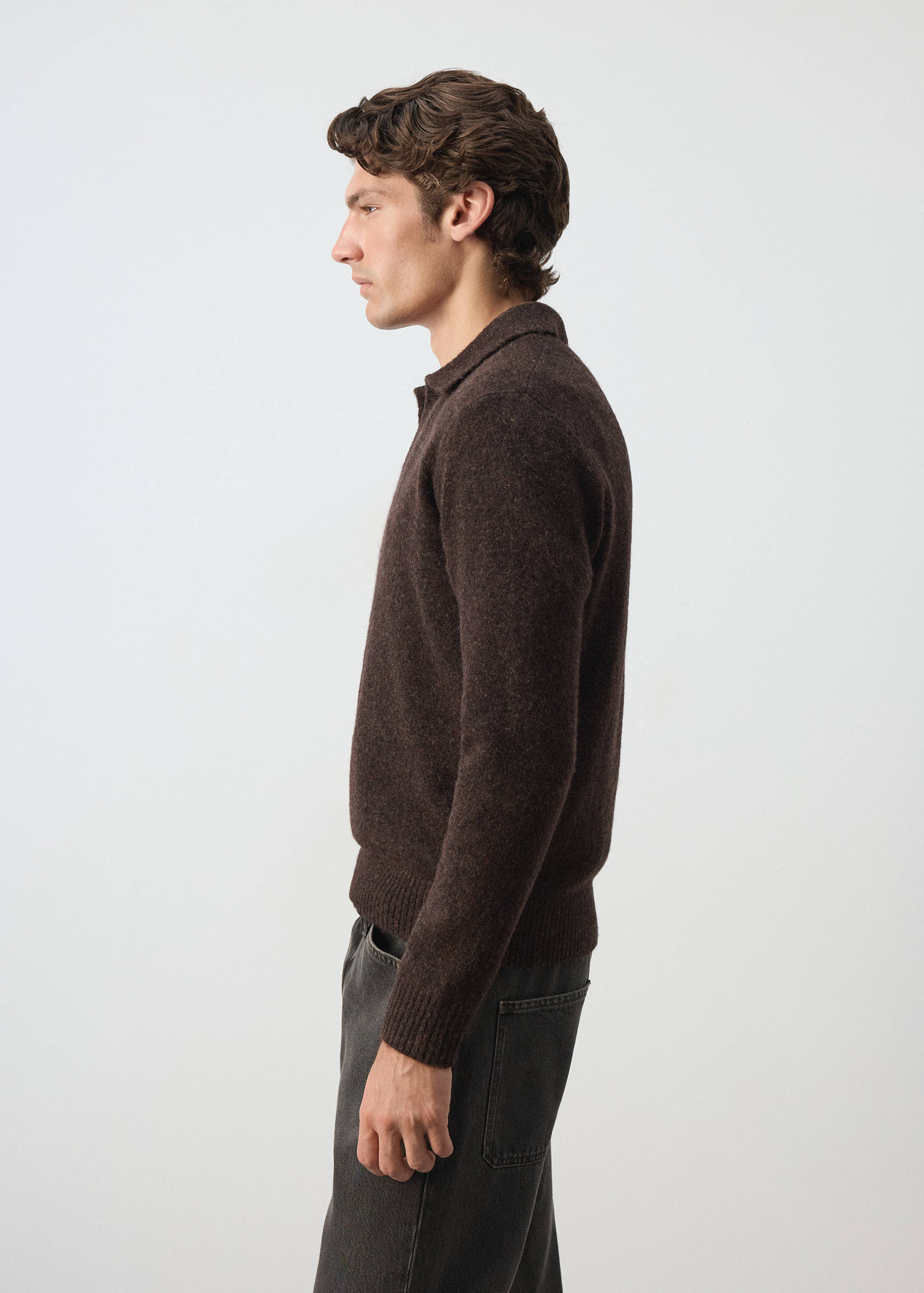 Dark brown knitted polo shirt with long sleeves and a classic collar.