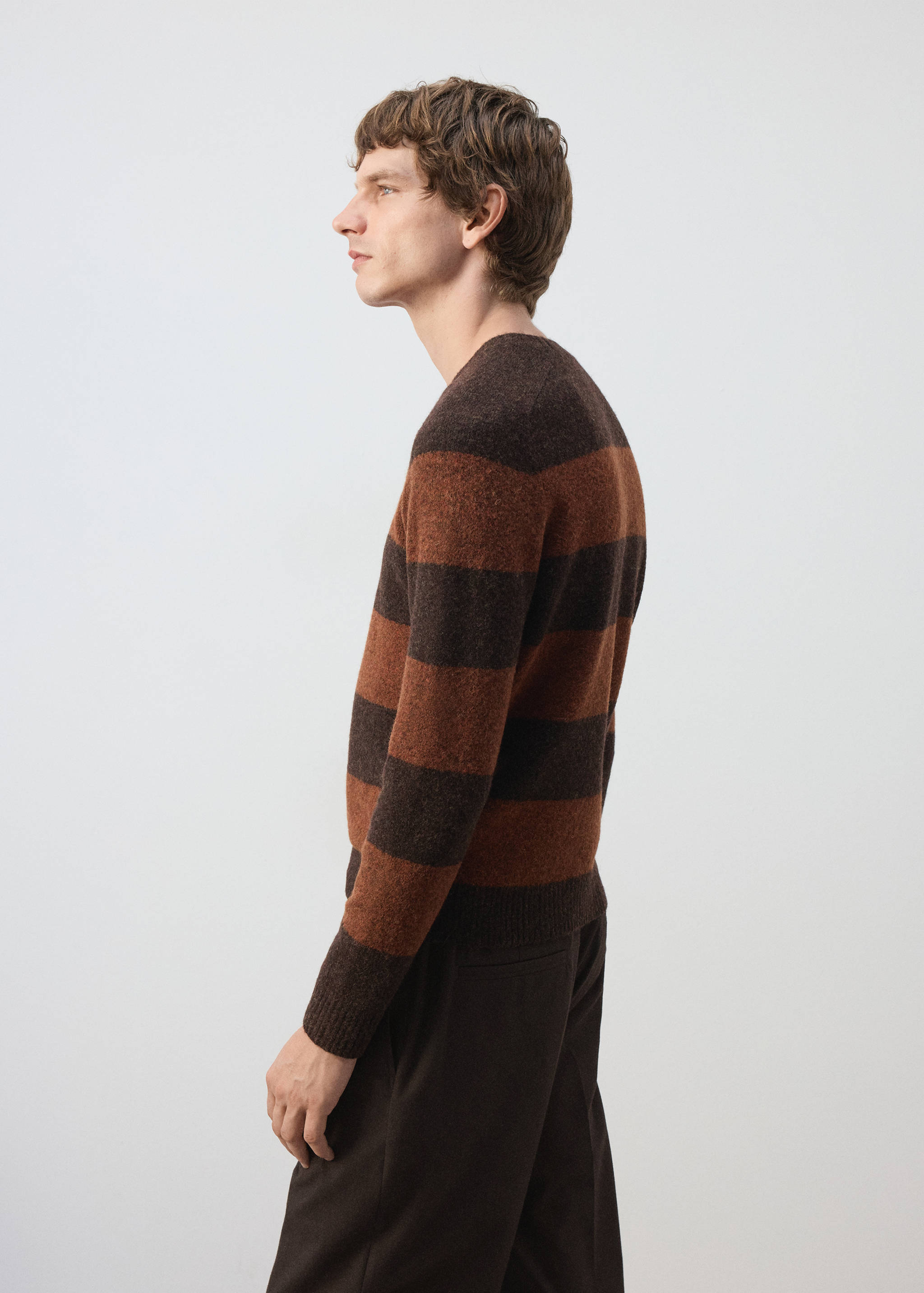 Brown and rust orange striped knit jersey with a crew neck.