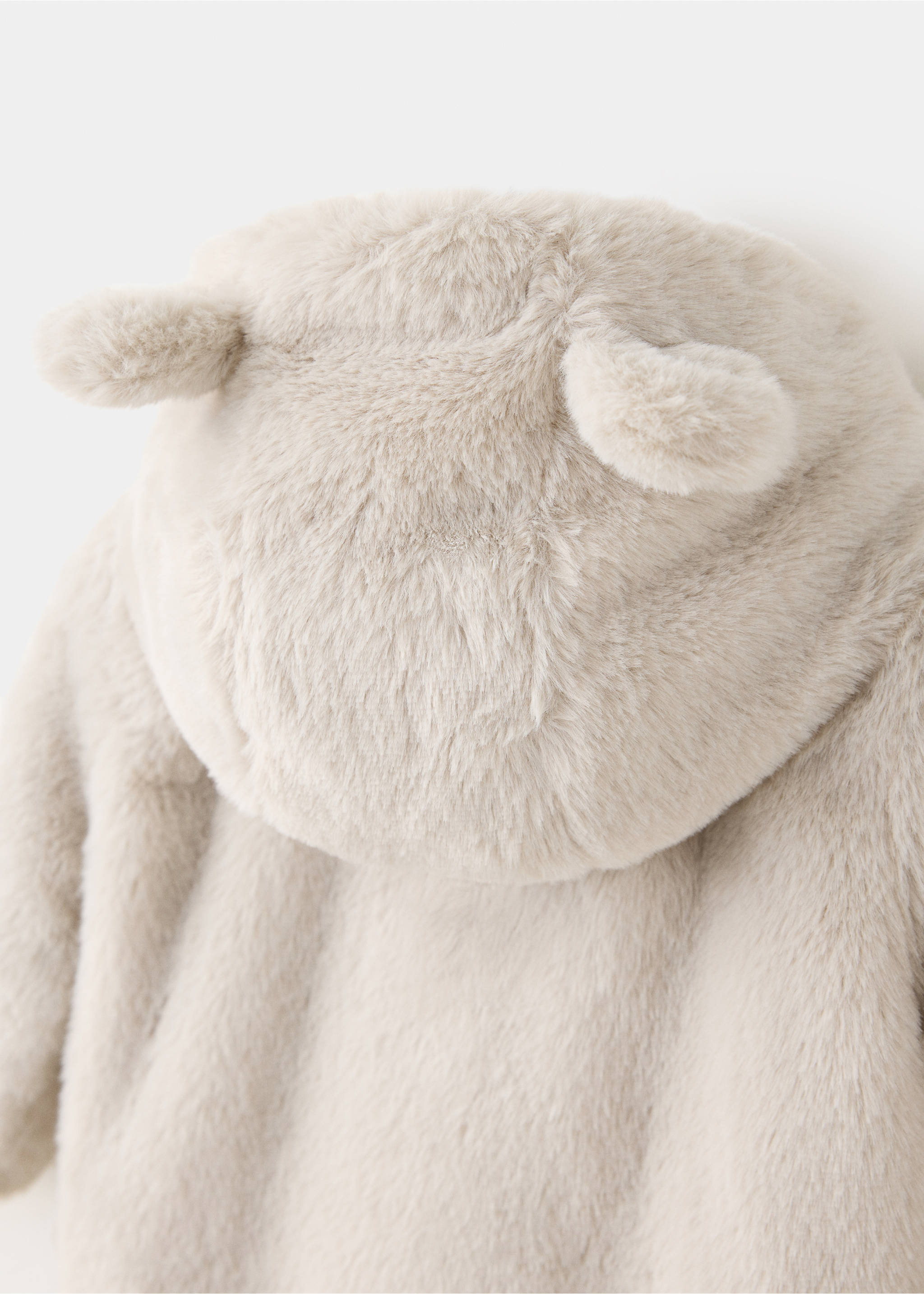 Close-up of a beige kids' faux-fur coat hood with ears., Sand. Ref: 37047918-00.