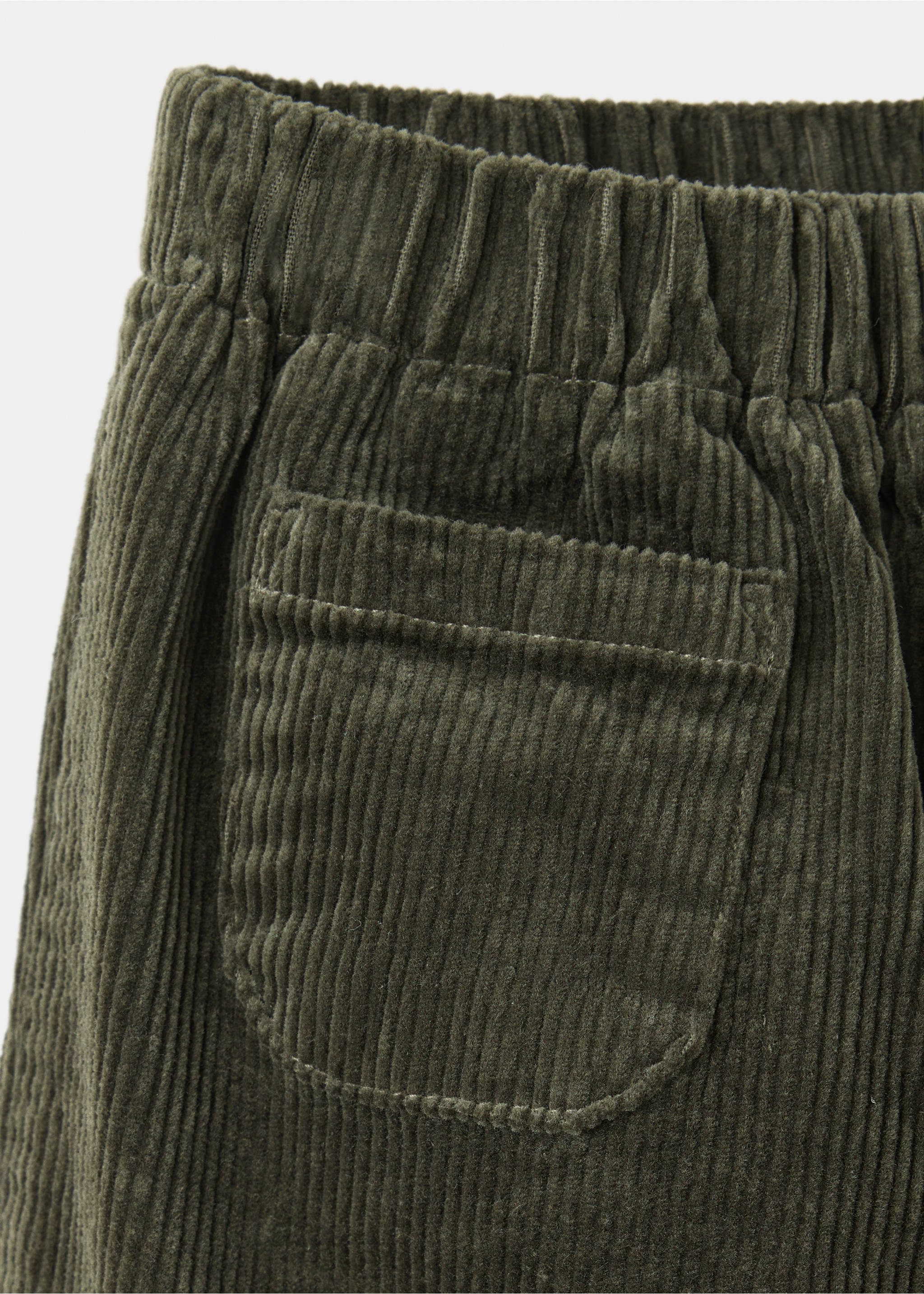 Olive green corduroy trousers detail showing the fabric and pocket, Dark Green. Ref: 37047927-00.