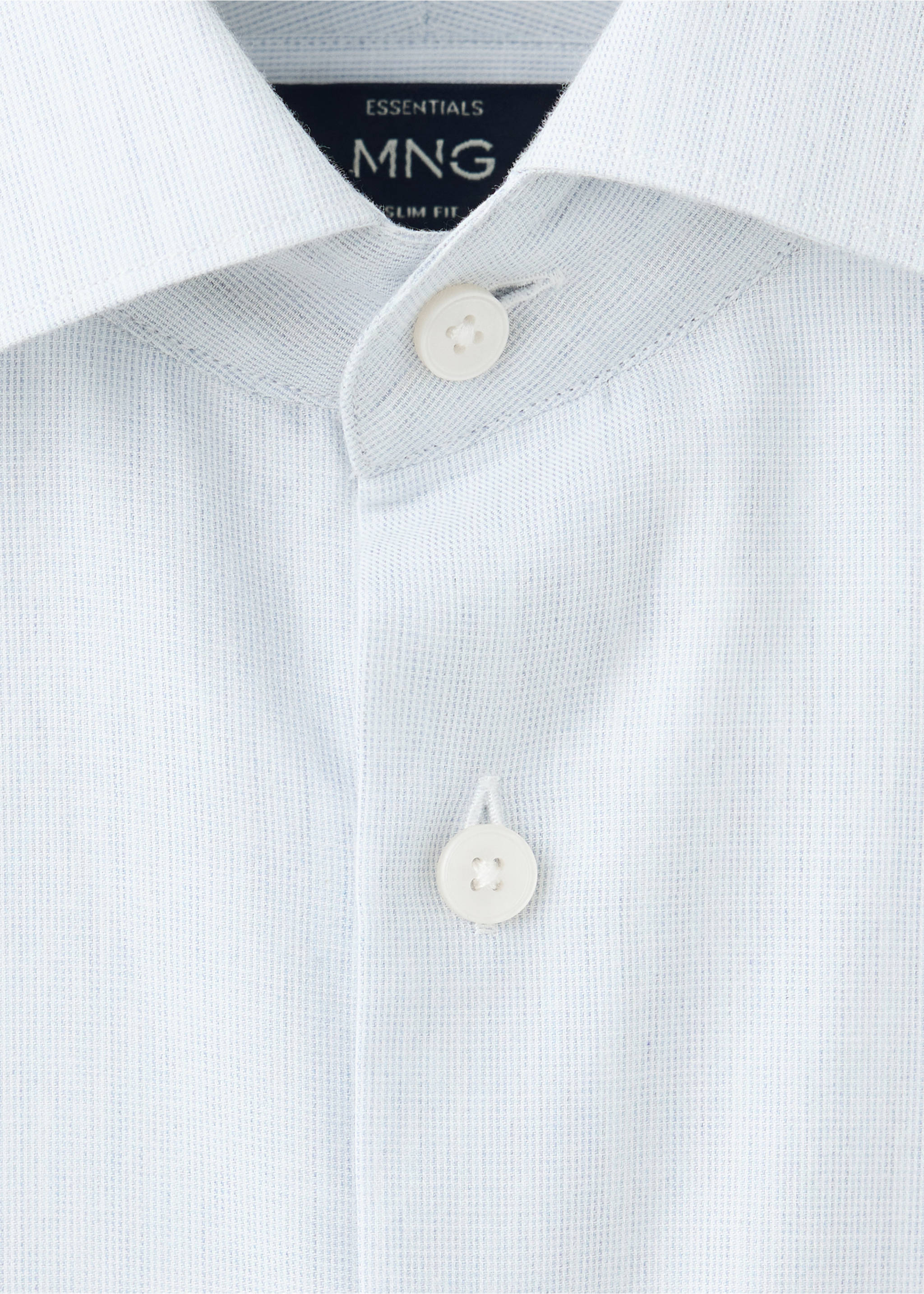Close-up of a light blue patterned shirt collar and button placket., White. Ref: 37047934-00.