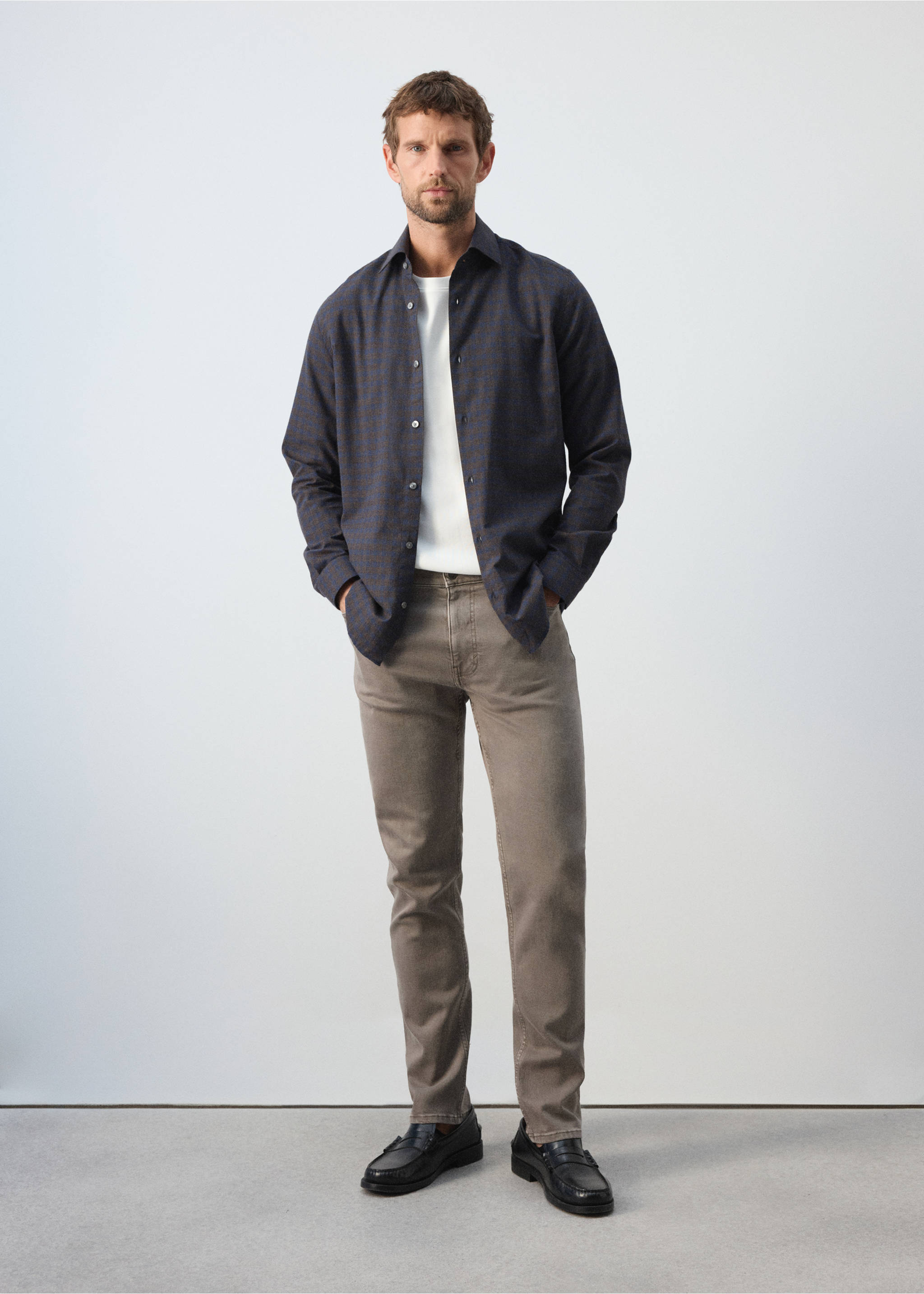 Dark grey patterned shirt worn open over a white t-shirt with grey trousers., Brown. Ref: 37047934-00.