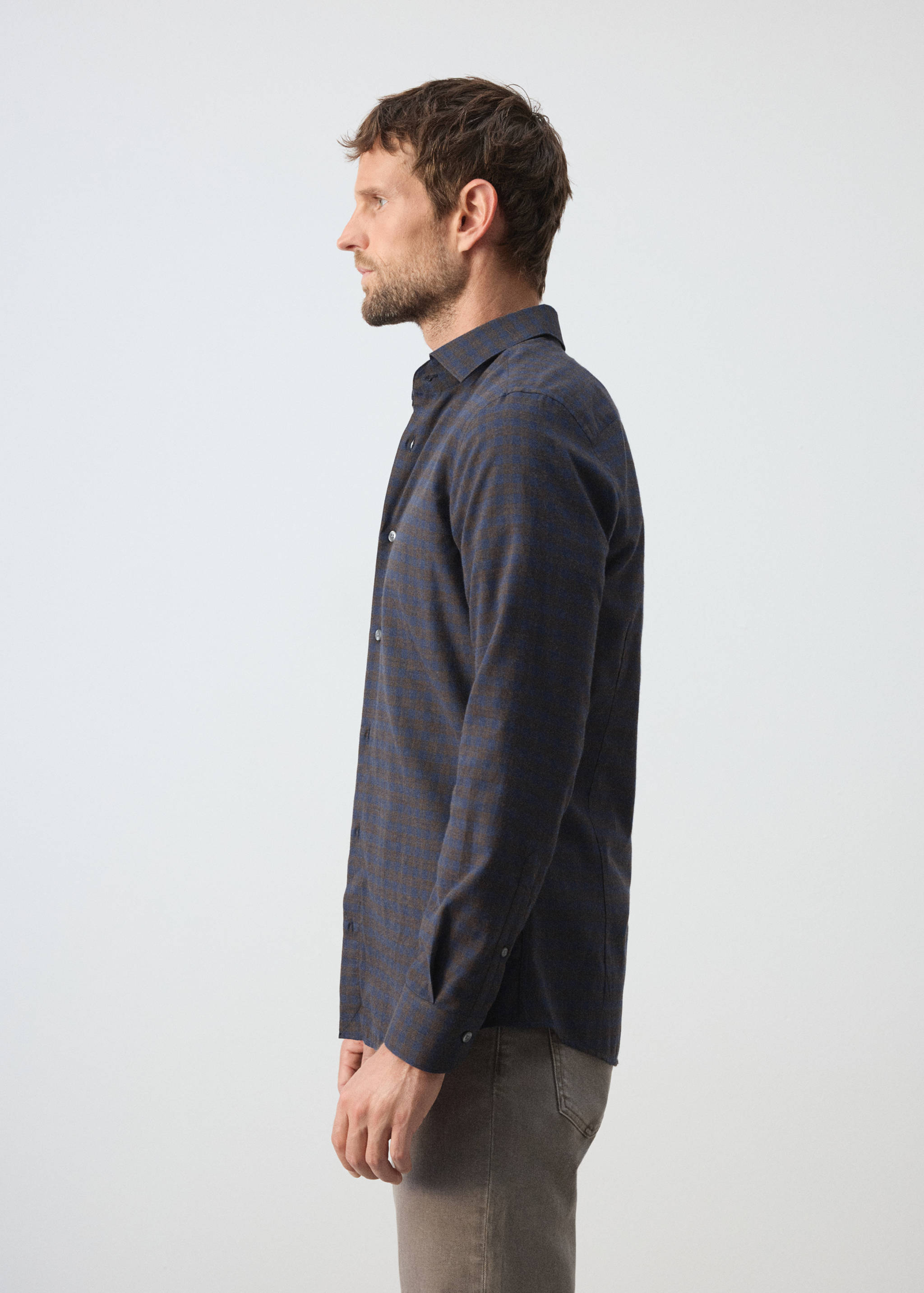 Blue and brown checkered long-sleeved shirt with a classic collar.