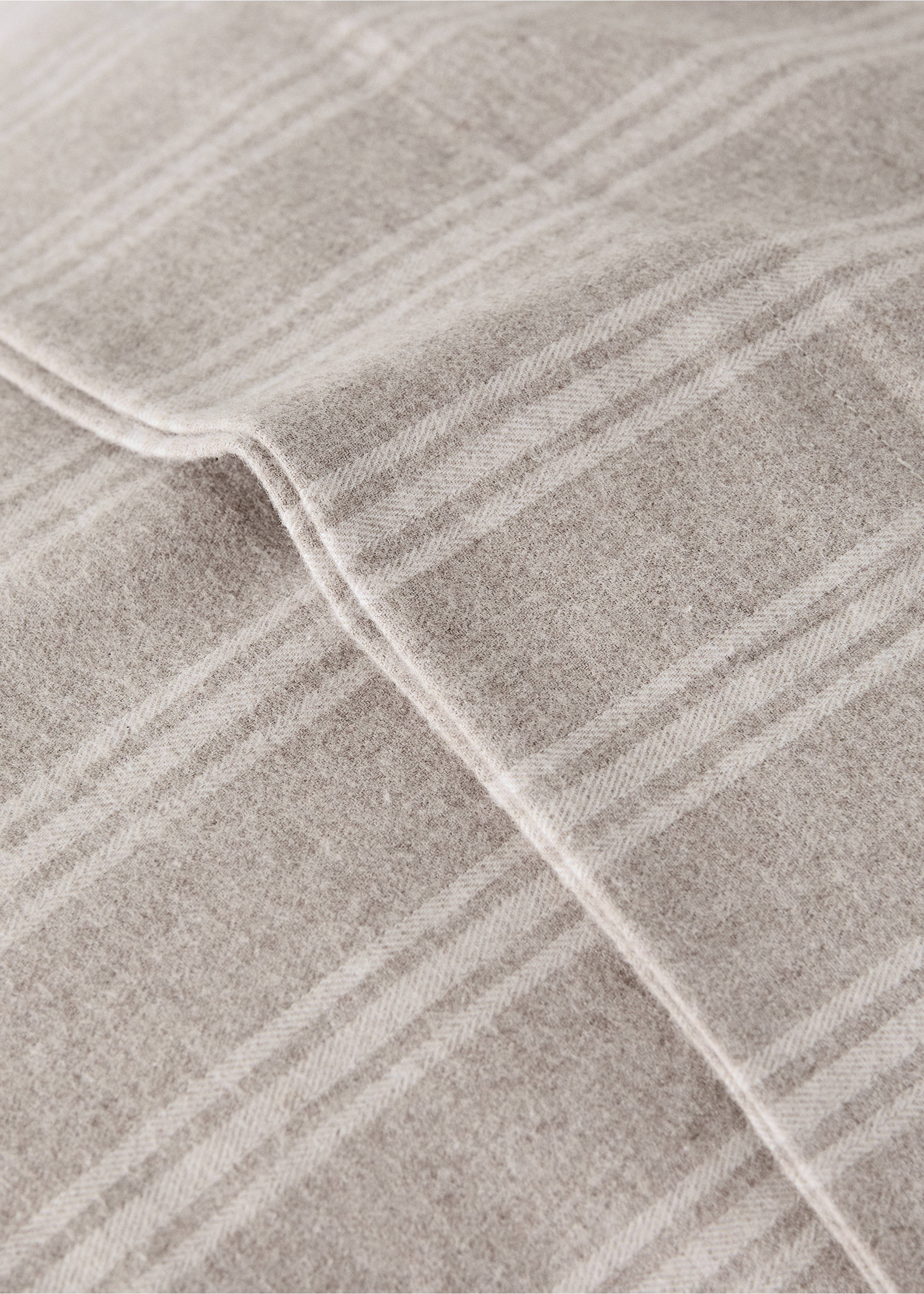 Beige checked pillowcase detail with textured fabric., Beige. Ref: 37048267-00.