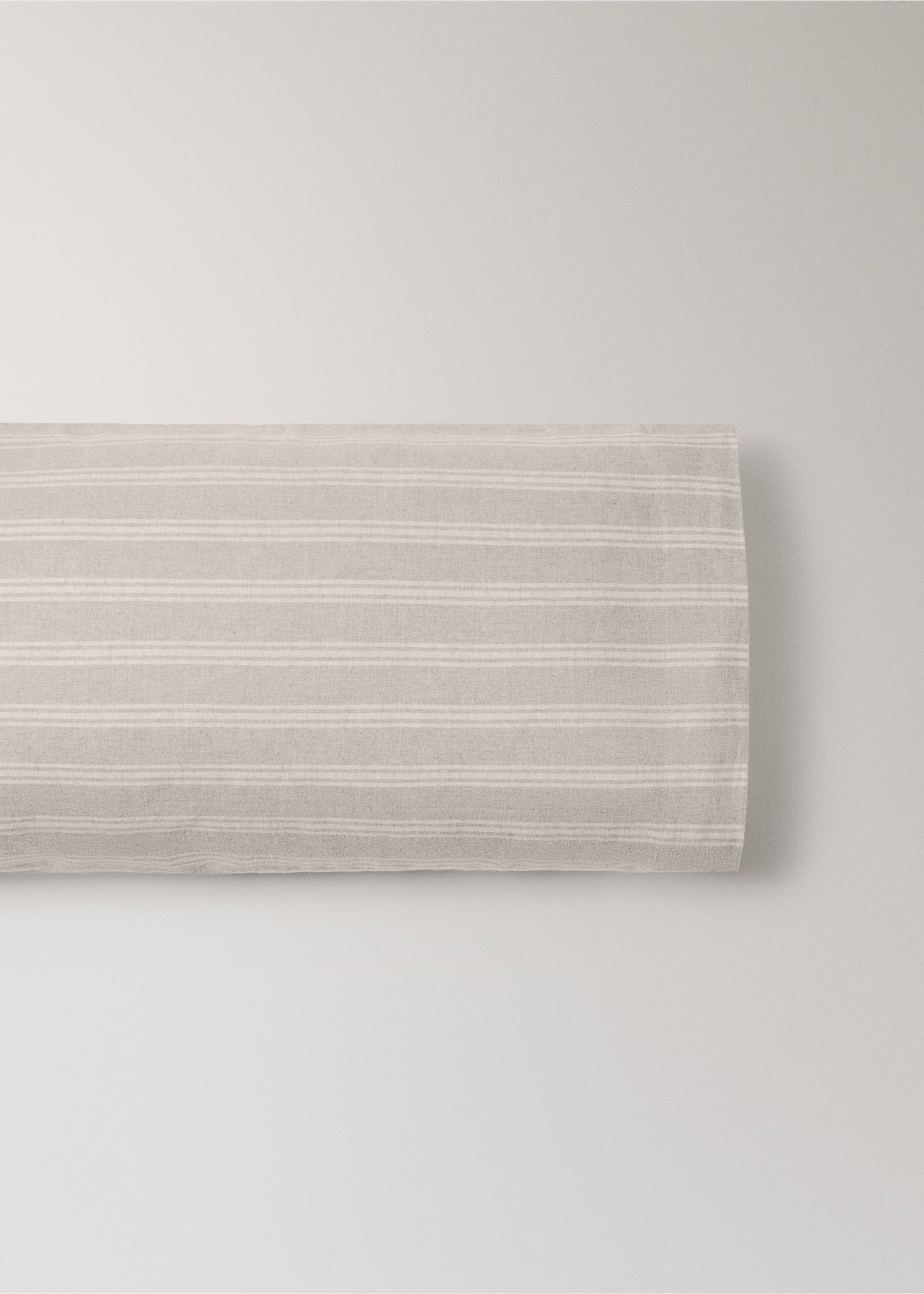 Beige and white striped pillowcase in a studio still life., Beige. Ref: 37048267-00.